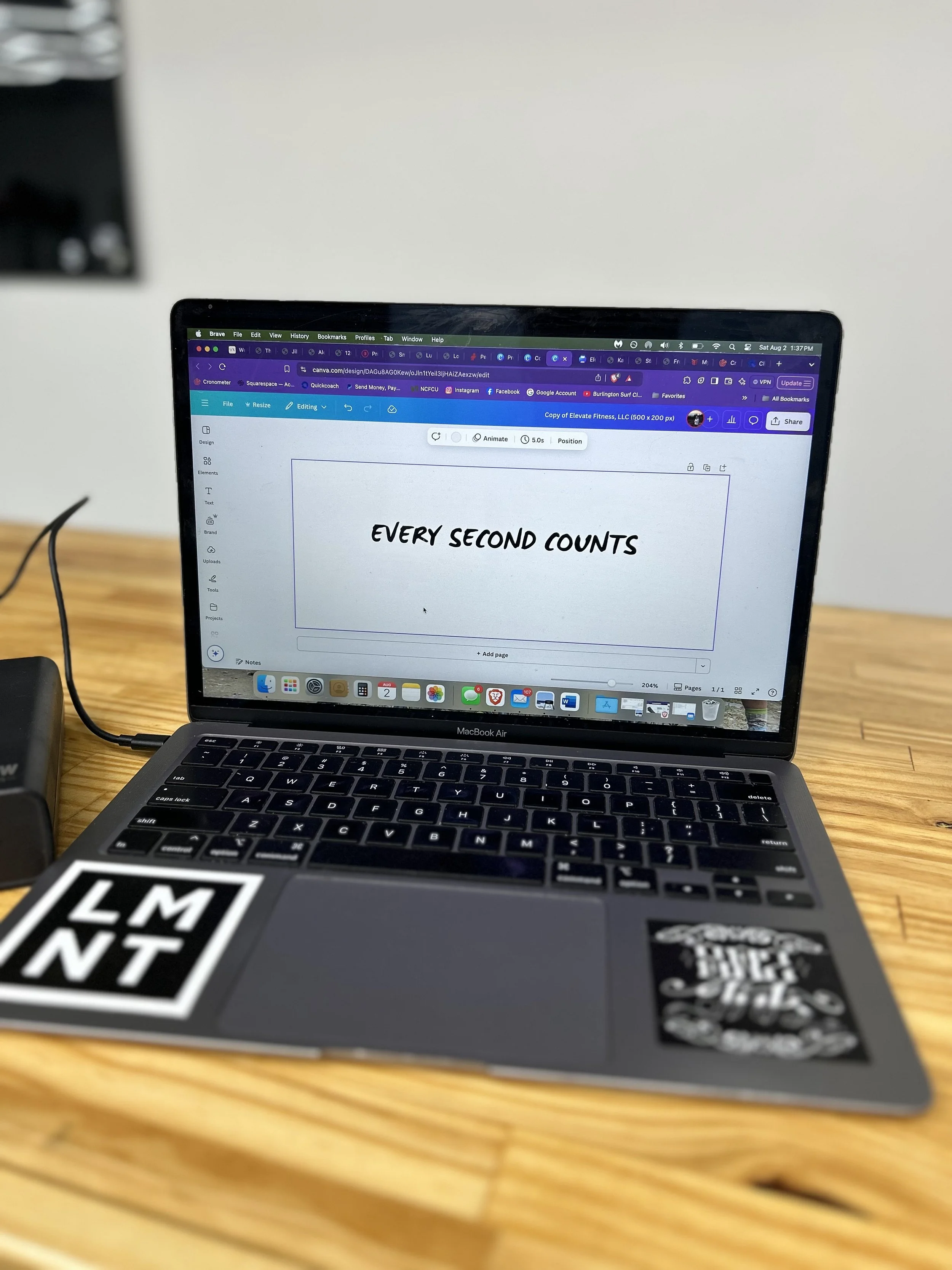 Laptop computer on a counter with writing on the screen.