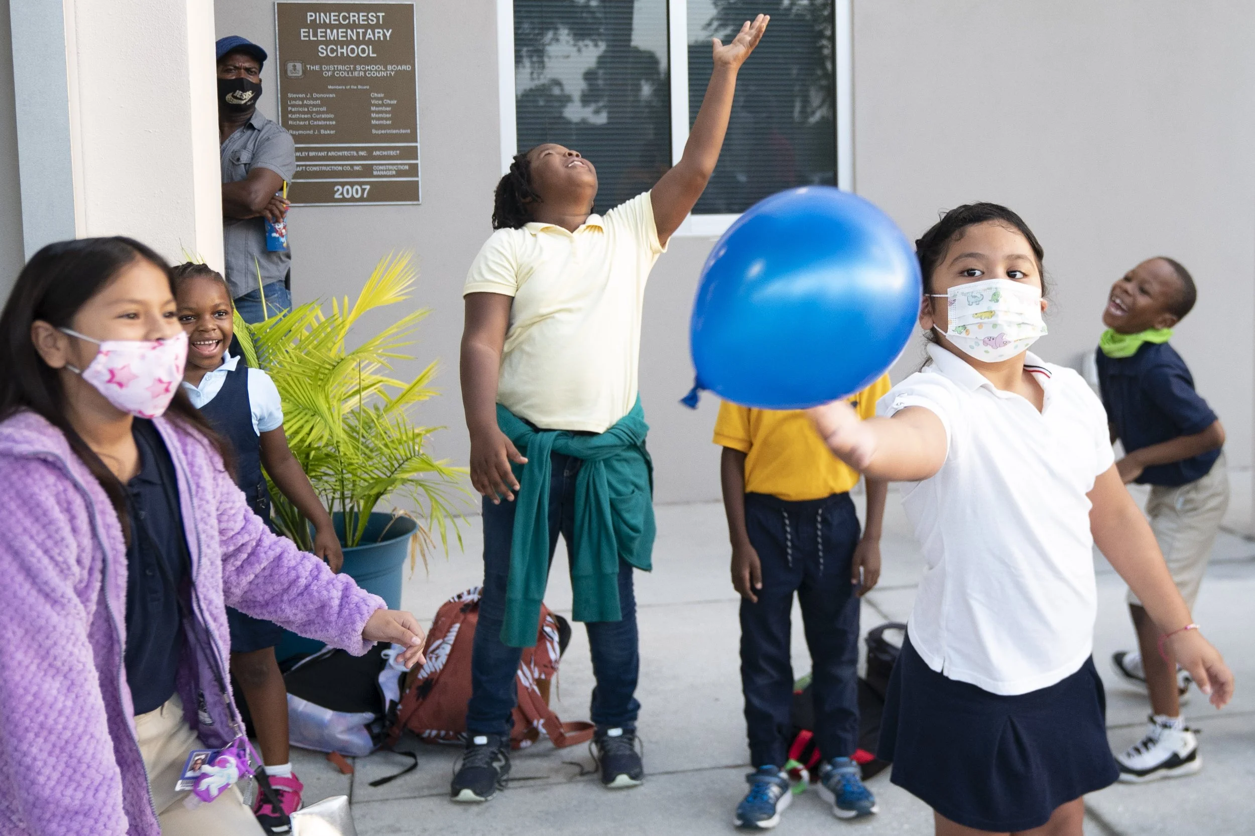  A Pinecrest Elementary School student plays with a balloon during Pinecrest Elementary School’s celebration of its A-rating, Thursday, Oct. 7, 2021, at Pinecrest Elementary School in Immokalee, Fla.  Pinecrest Elementary School raised its grade from