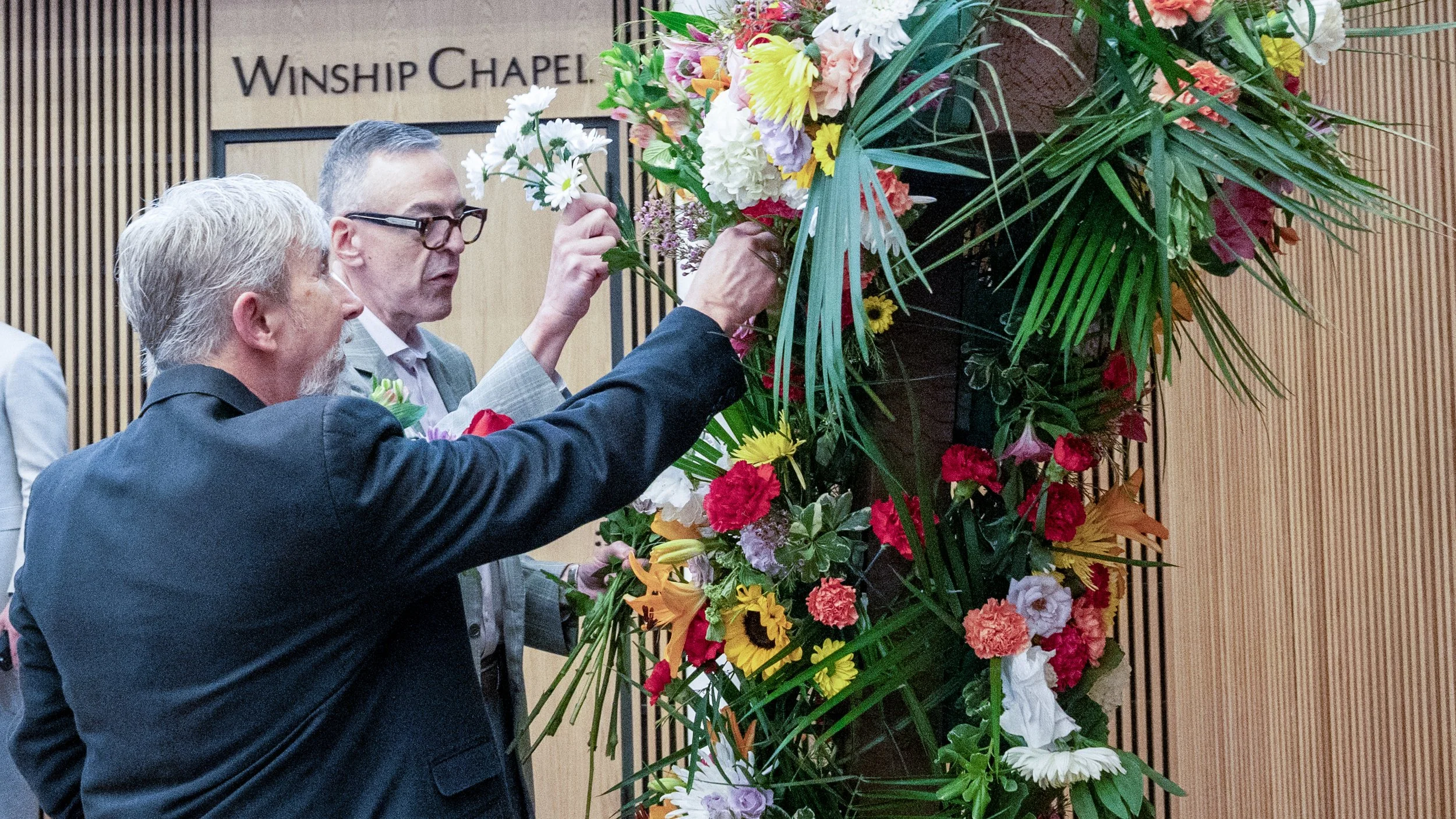 Easter 2026 Brian and Husband placing flowers.jpg