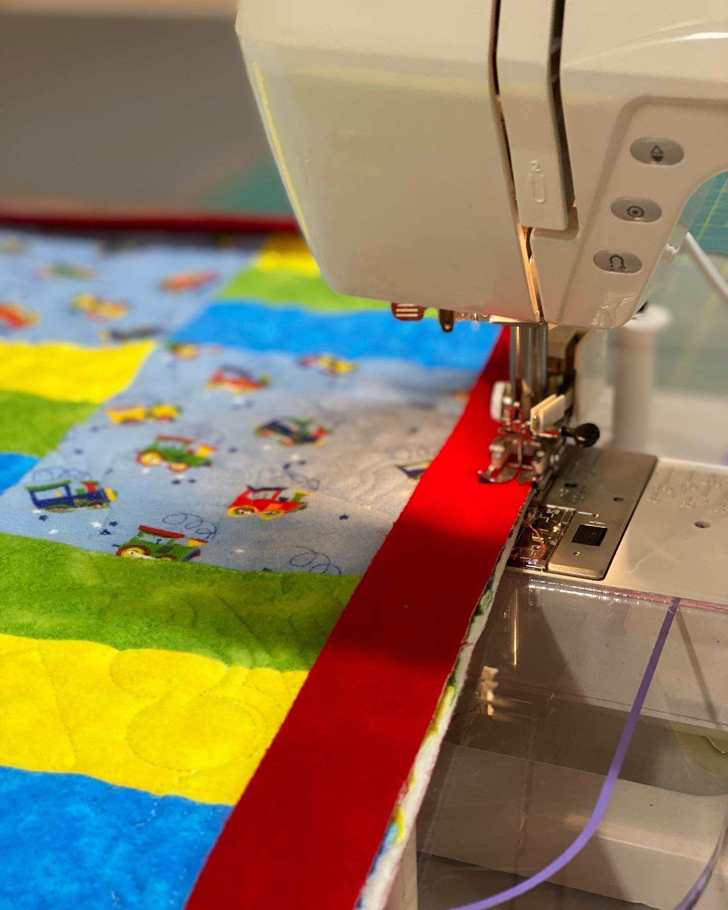 Super cute kids train quilt! I adore the rail fence pattern, it really lets you showcase the main print fabric. #longarmquilting #longarmquilter #207lq #gammill #gammillquilting #statlerstitcher #mainesmallbusiness #mainequilts #mainequilters #longar
