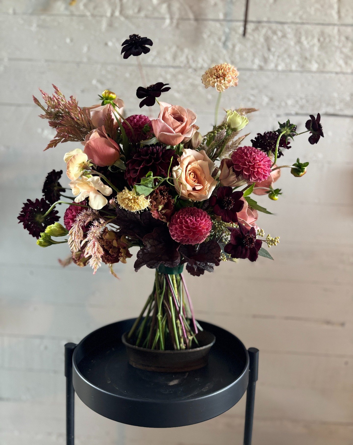 A couple of years ago I started designing all of my hand held bouquets without greenery, unless it was specifically requested. I like the way colors work without the interruption of the green. And let's be honest, there is plenty of green in the flow