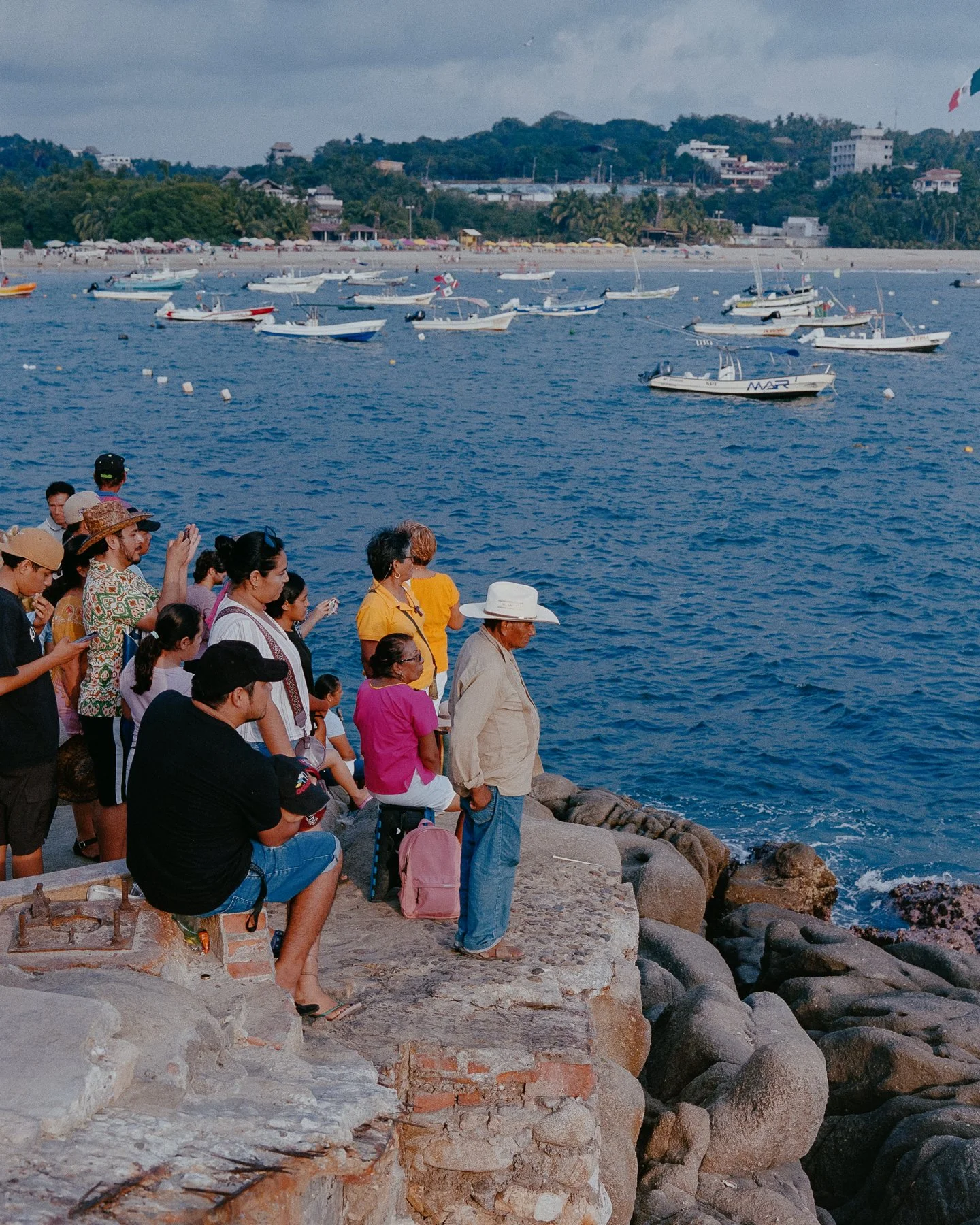 People waiting for the Virgin of Solitude to be brought back to land