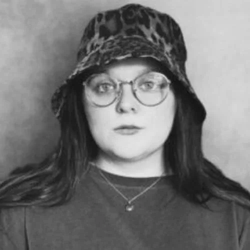A black and white photograph of writer Lucy Rose