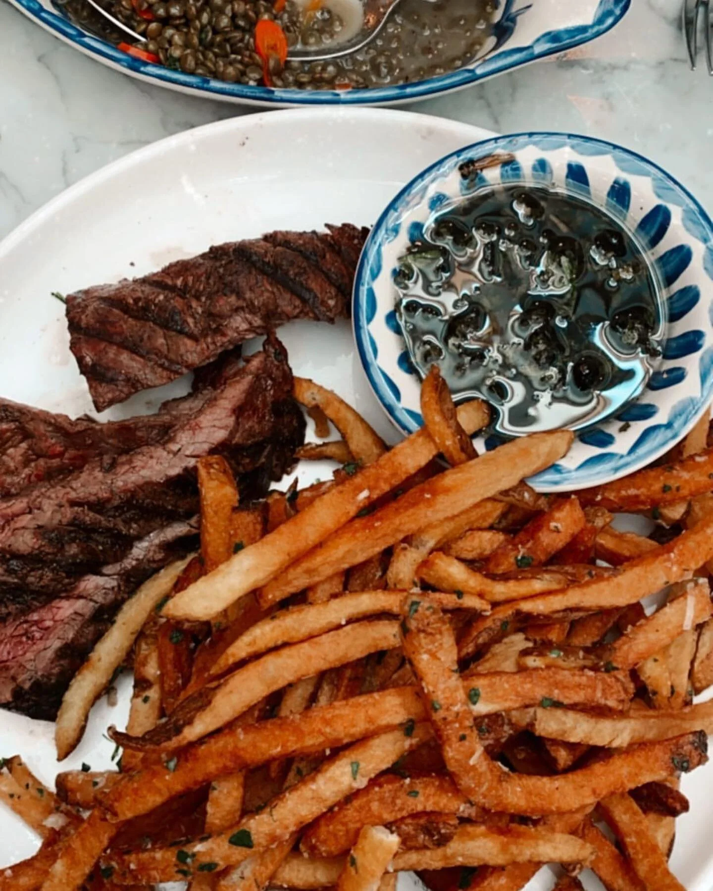 Steak frites with rosemary garlic butter French fries and Chef Nick&rsquo;s perfect salsa verde 🙌🏼
📸: @the_sofsterbrady