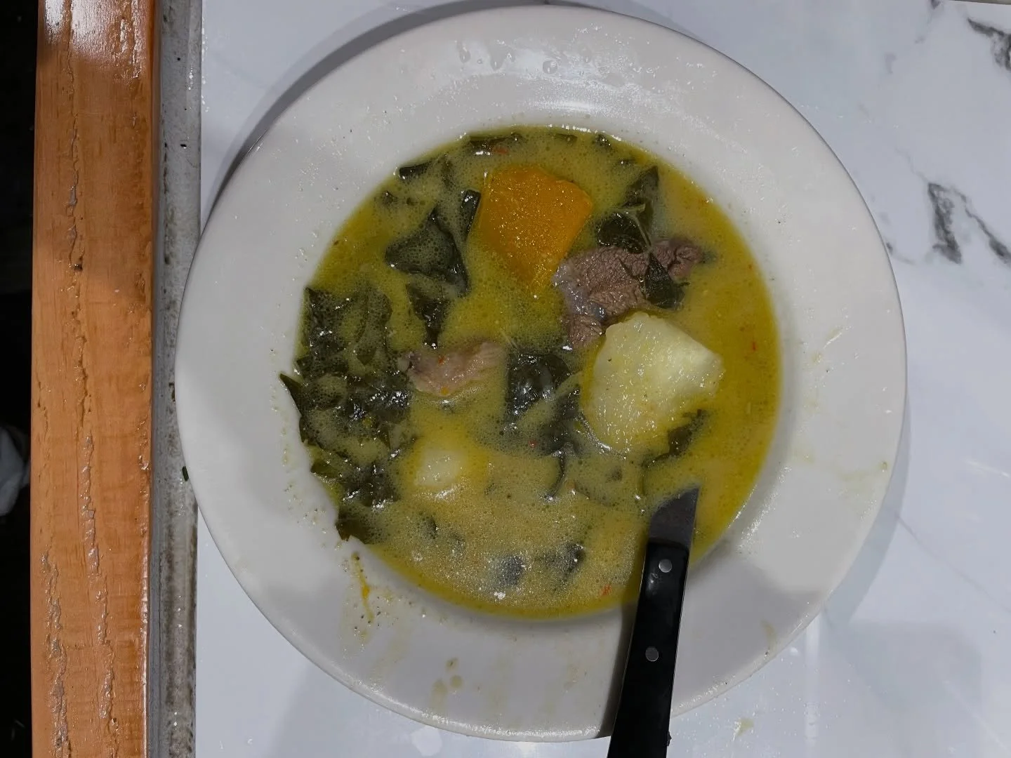 And the caldo with cassava, bele, kabocha, and beef, seasoned with cocona, 'olena, cocona, Brazilian starfish chili, and Kona salt