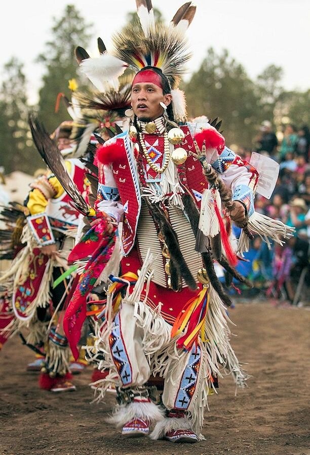 Tk’emlúps te Secwépemc First Nation member dancing at a pow wow