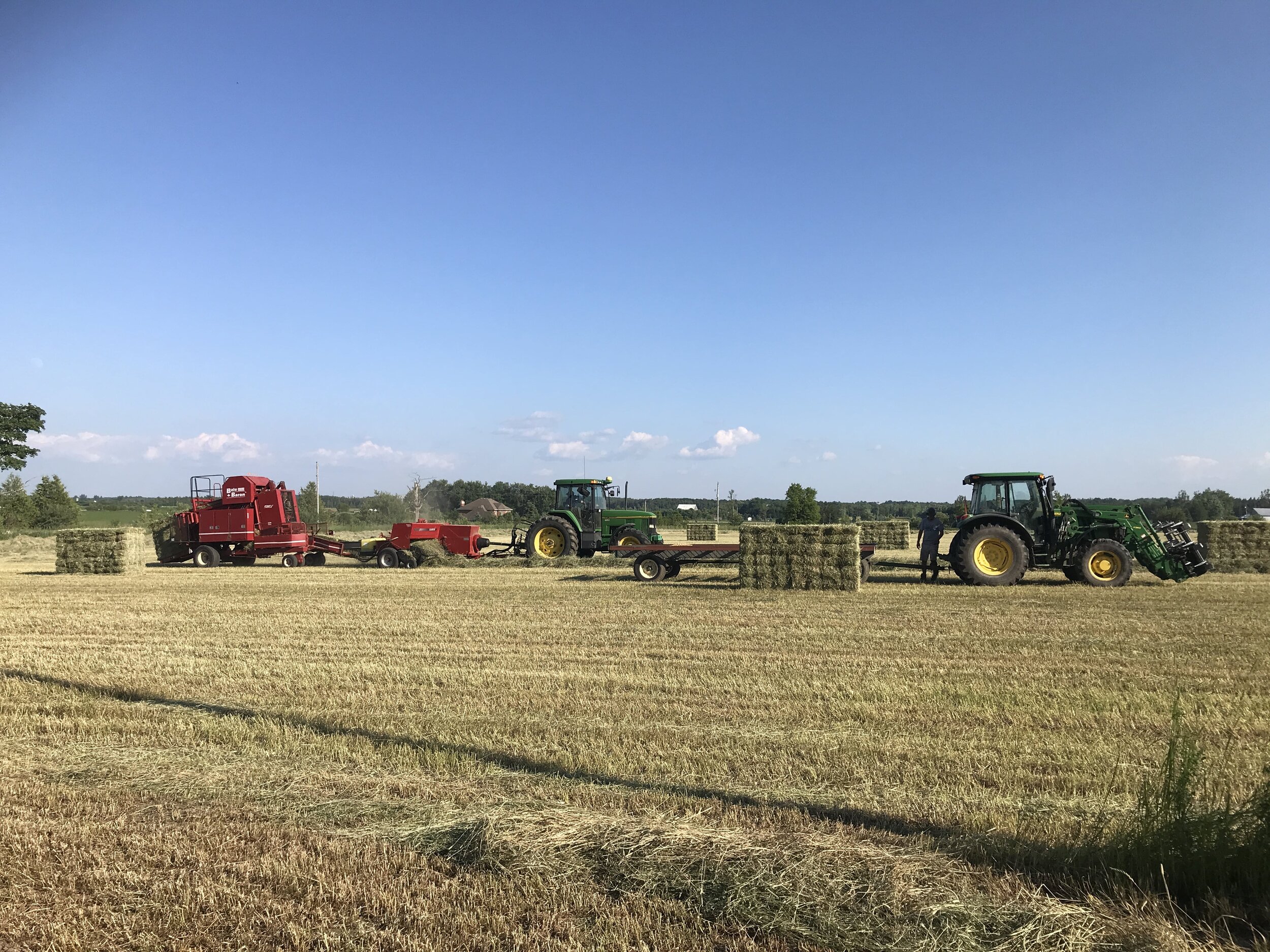 tractors in a beautiful farm field