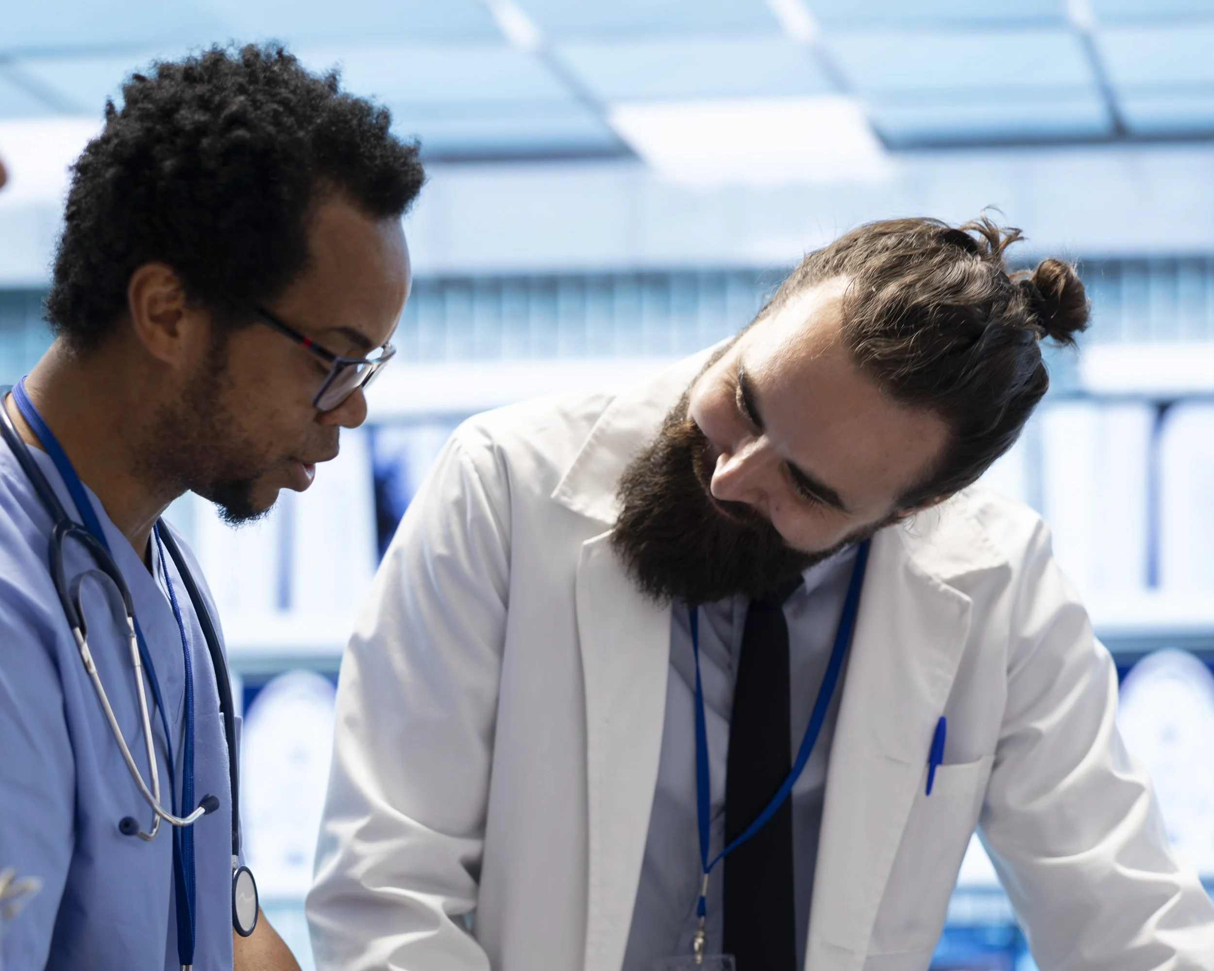 Two clinical professionals collaborating or strategizing together.