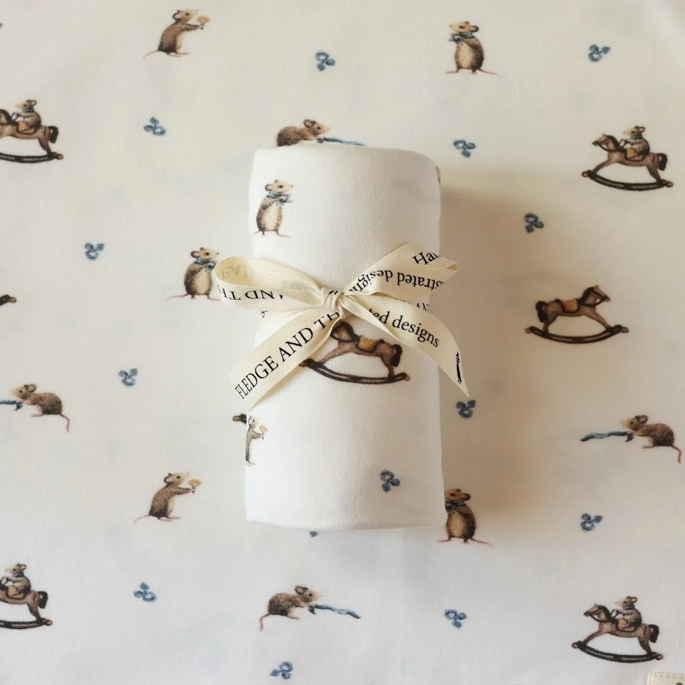 Stretch-swaddle-mouse-and-rocking-horse.jpg