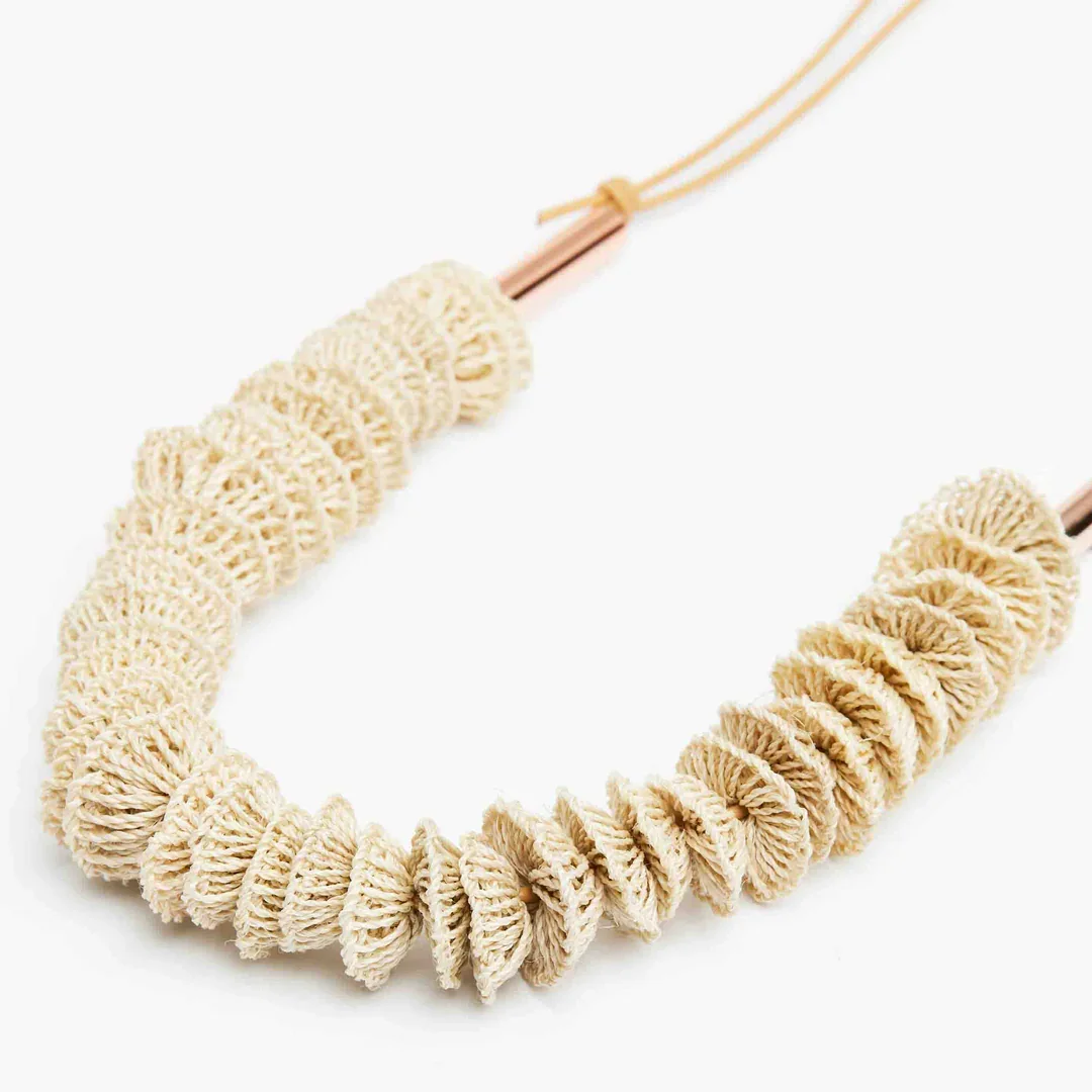 Leather-and-handwoven-natural-fibre-disc-necklace-Bilum-and-Bilas-yackandandah.webp