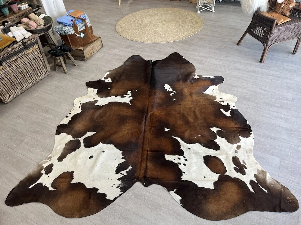 dark-brown-and-white-cowhide.jpeg