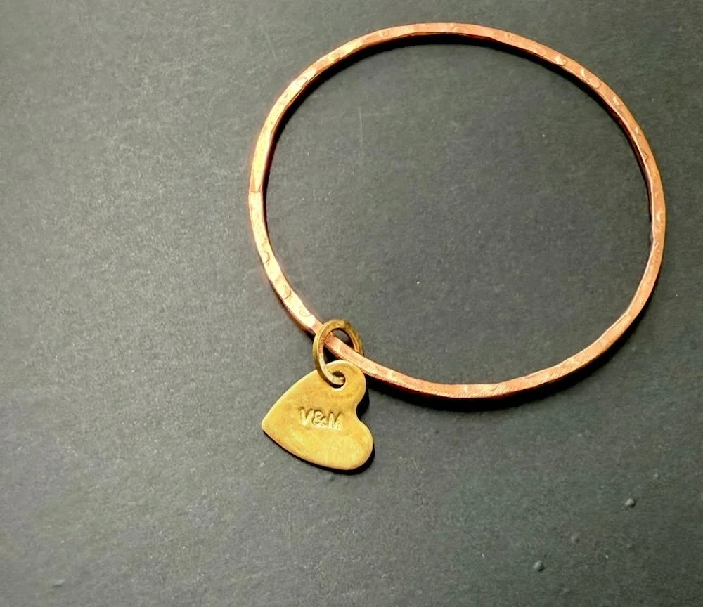 Thin copper bangle with brass heart