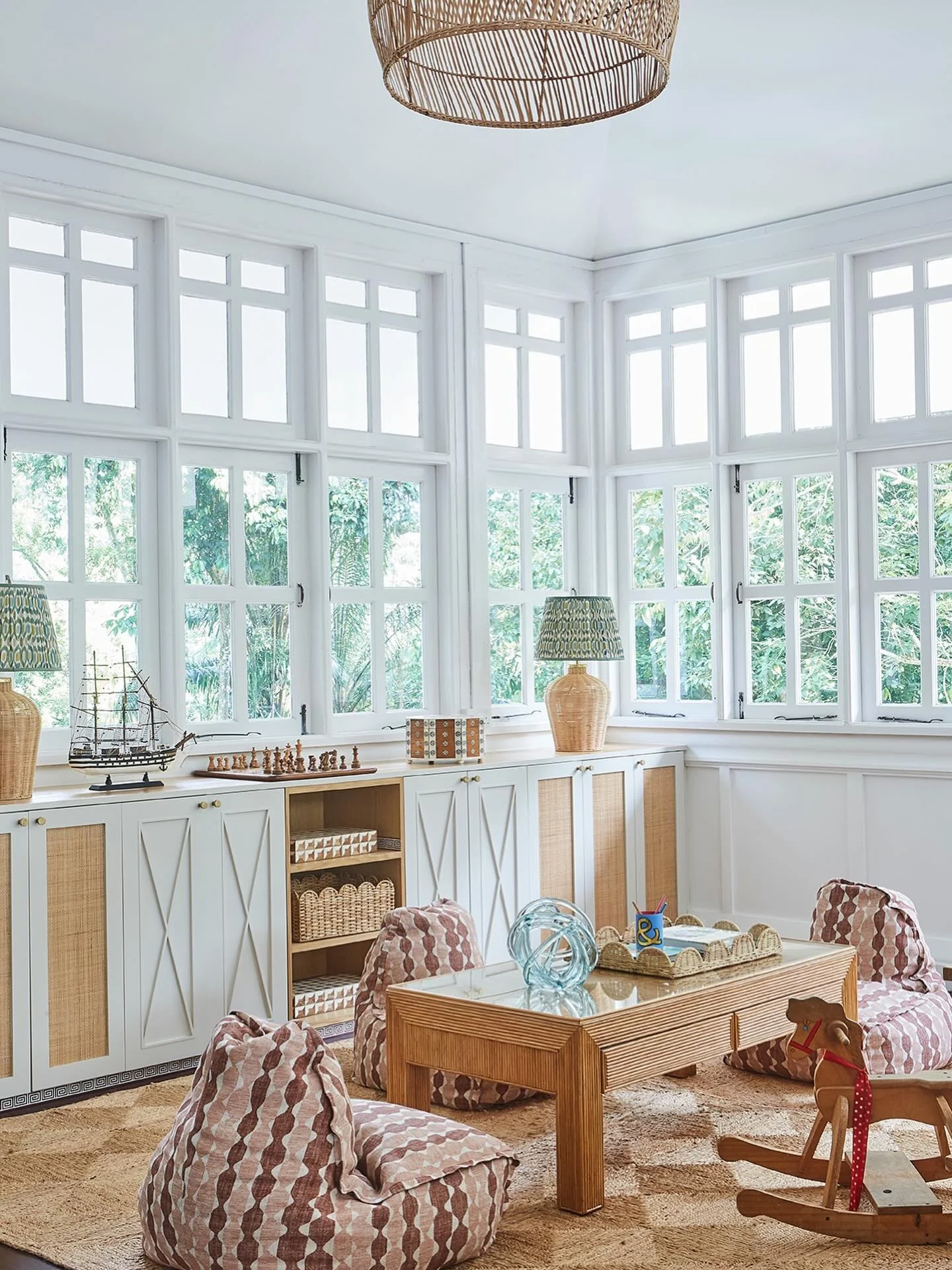 A lovely and bright kids area in the upstairs family room of this recently completed black and white project we designed for a wonderful family. We designed the built in storage that runs the entire length of the windows which keeps the many boxes of