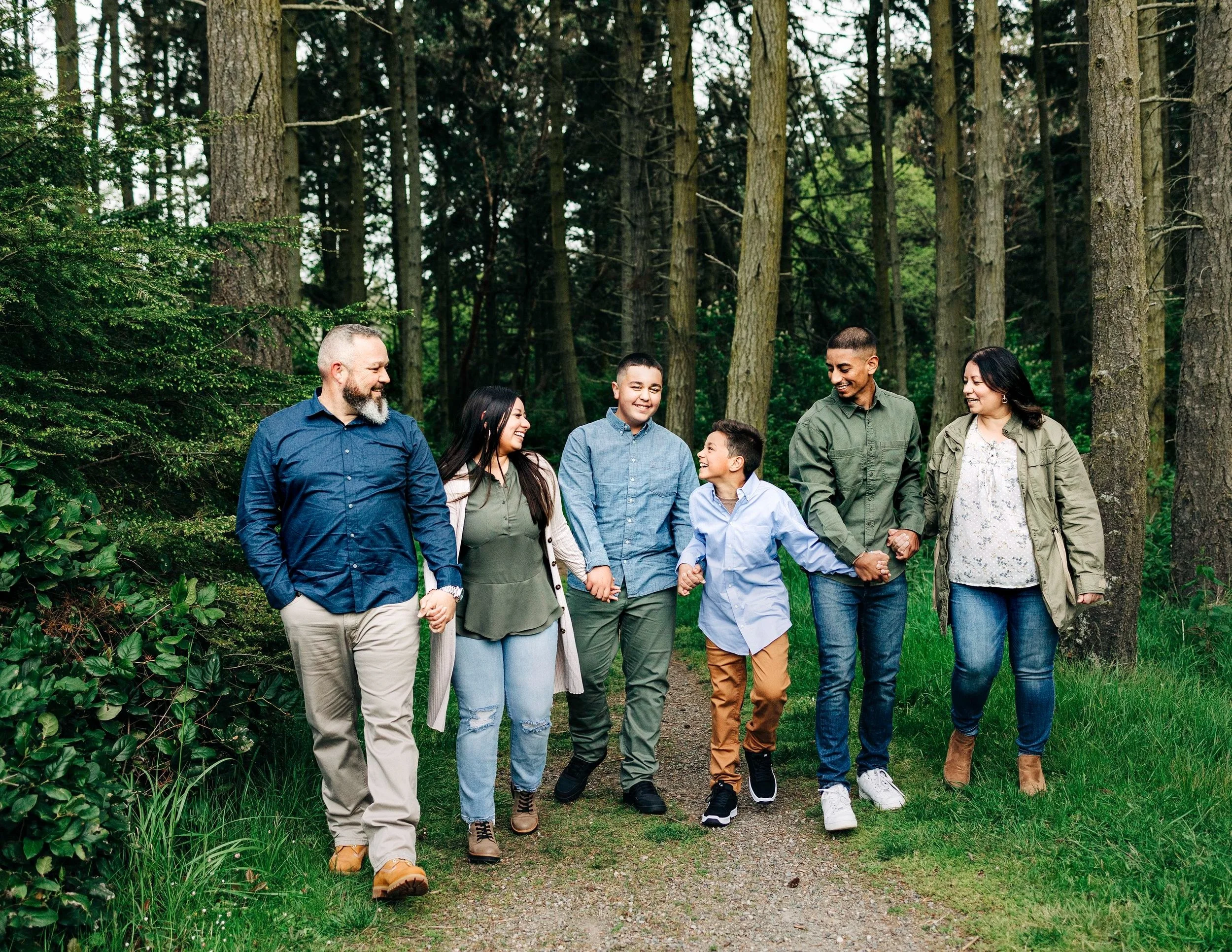 Professional portrait of a family of six taken in an outdoor setting