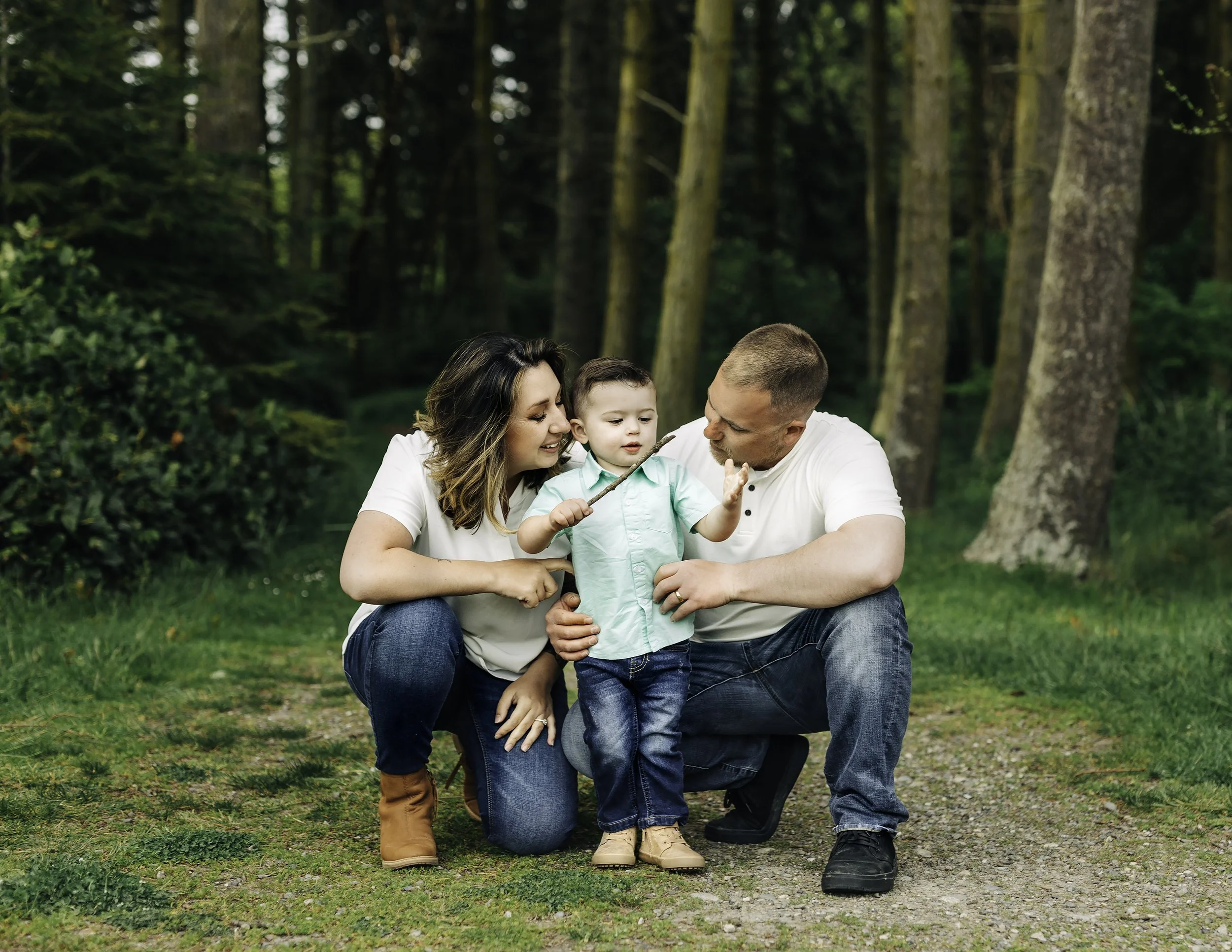 professional portrait of family of three taken outdoors