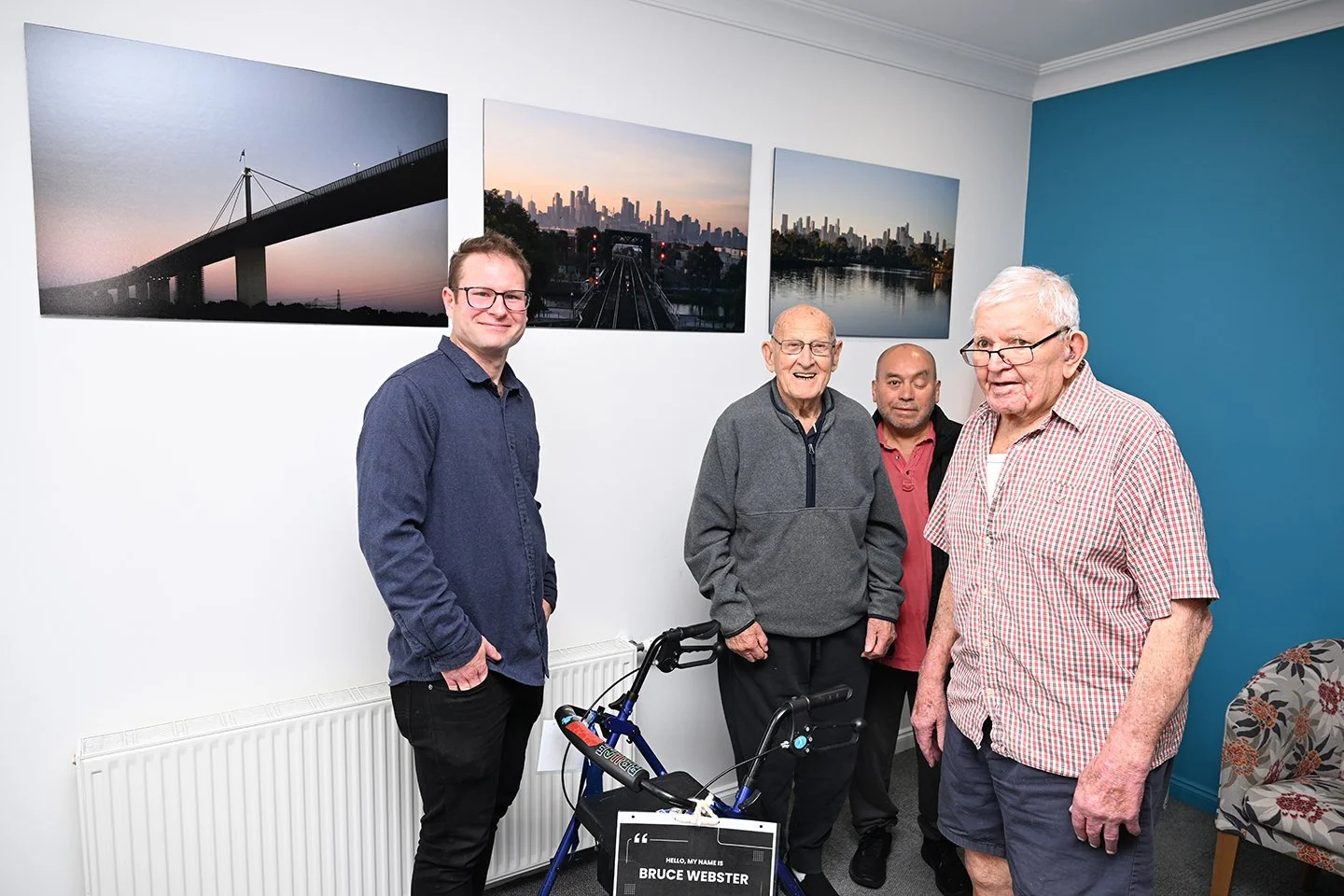 looking at the photos with residents Bruce Webster, Hugo Cuchilla and Harold Leigh Kear