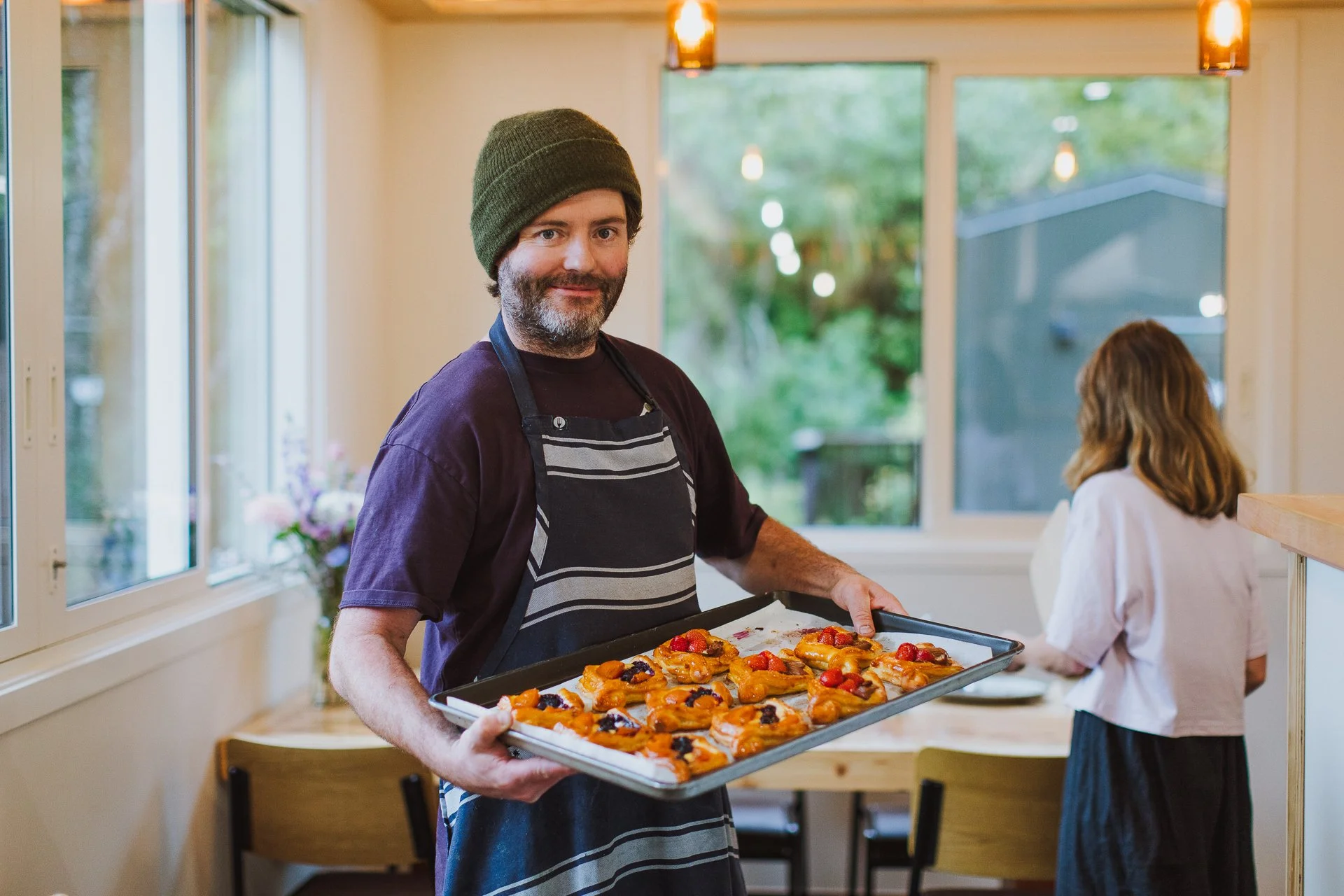 Augustines of Portobello Gus Hayden holding a tray of pastries