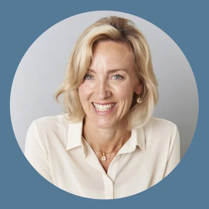 A woman with blonde hair, wearing a white blouse, smiling, against a light gray background with a circular border.