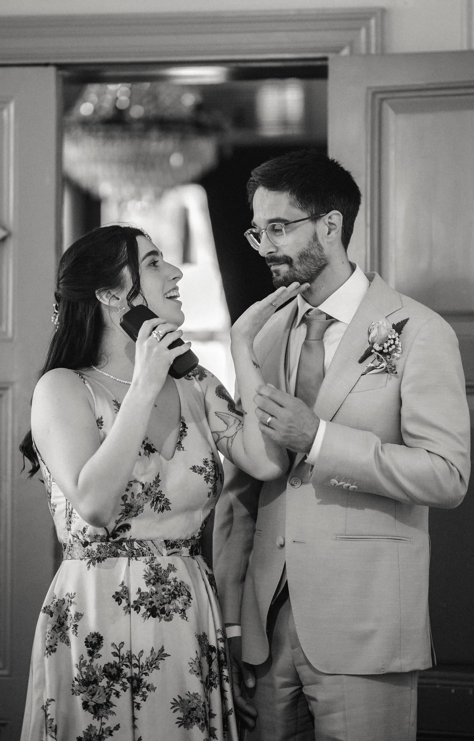 A woman and a man dressed in wedding attire engaging a wedding photo shoot in Stockholm