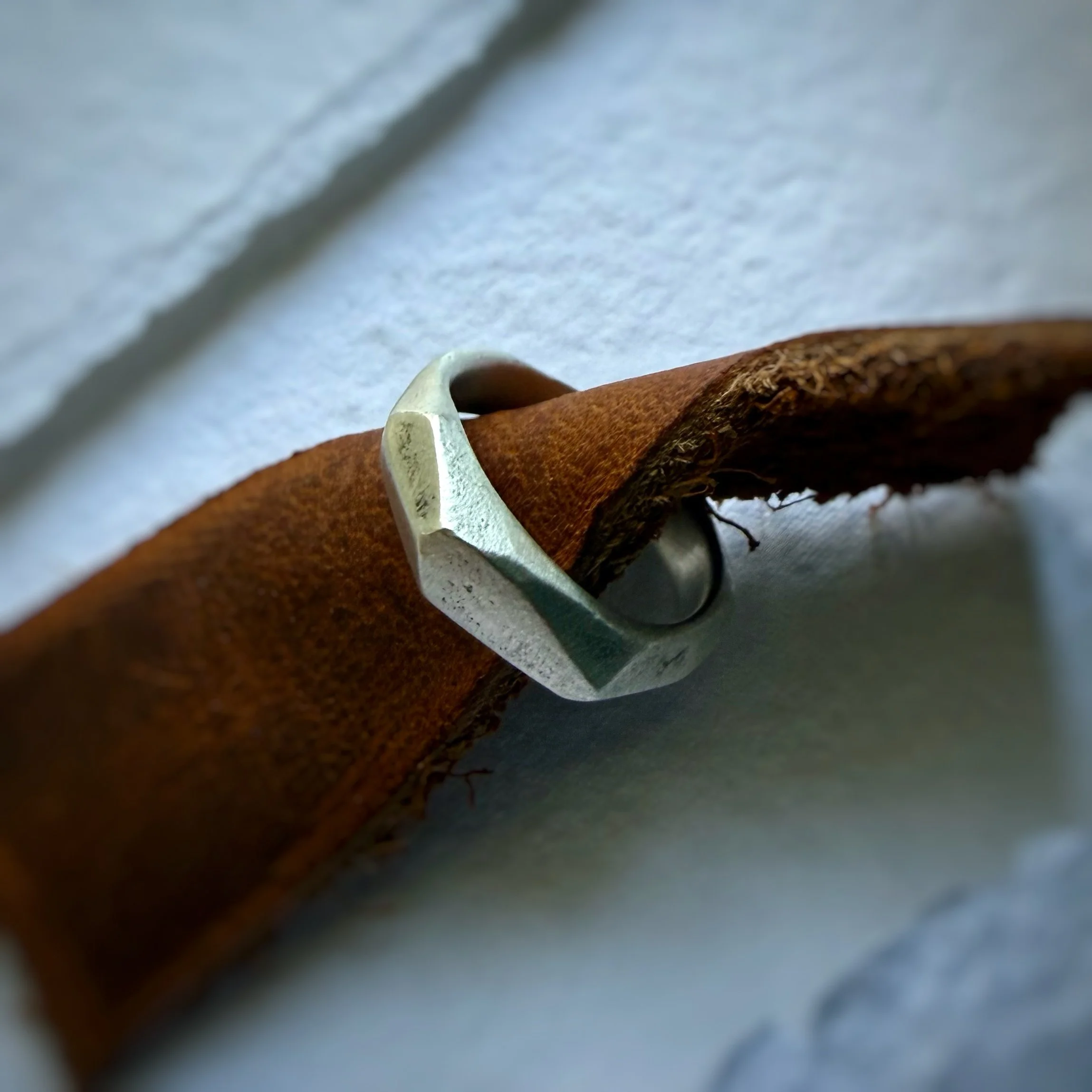 sand cast sterling silver facet band