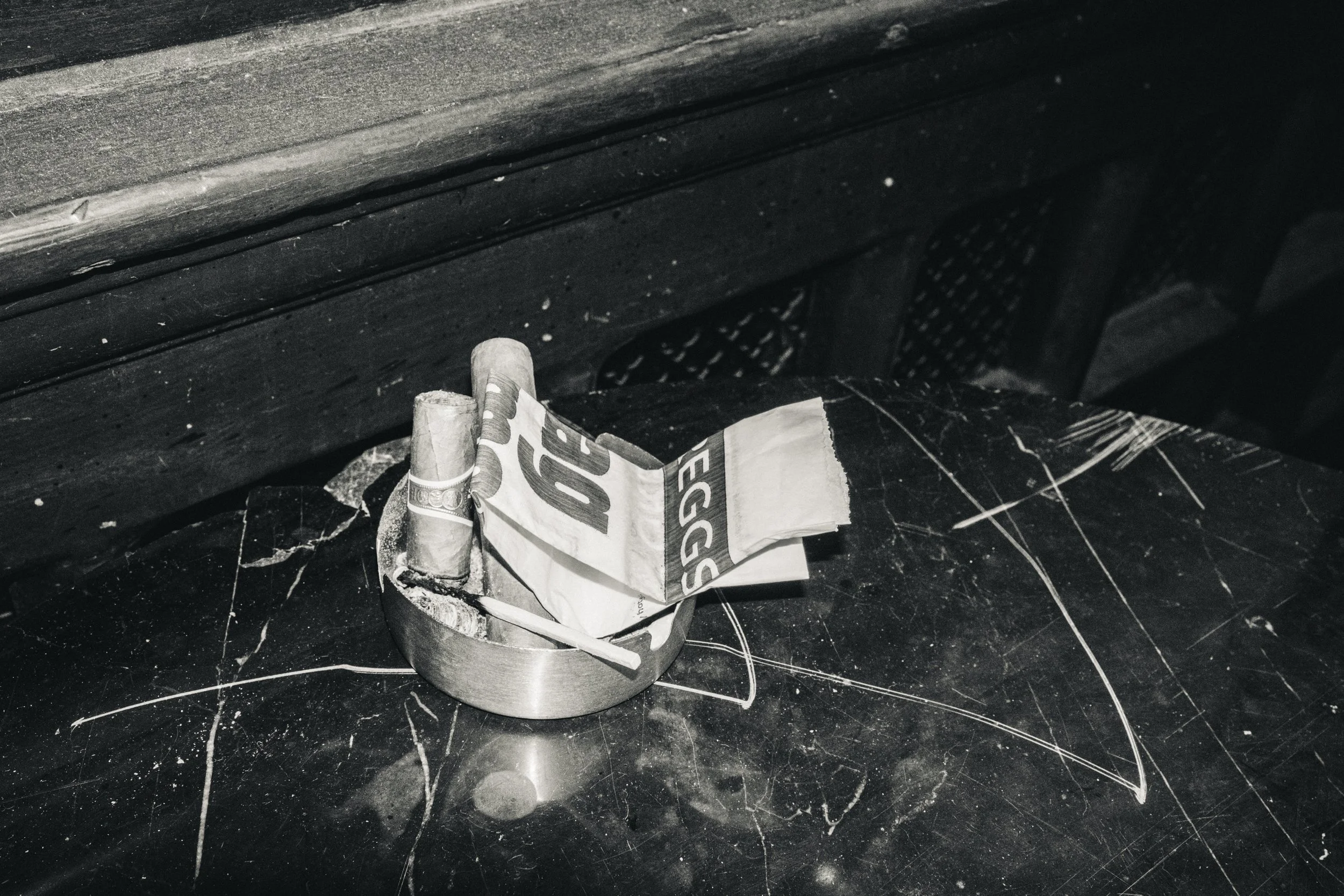 2 Cuban cigars, a Greggs folded paper bag, and one match in an ashtray - work in progress