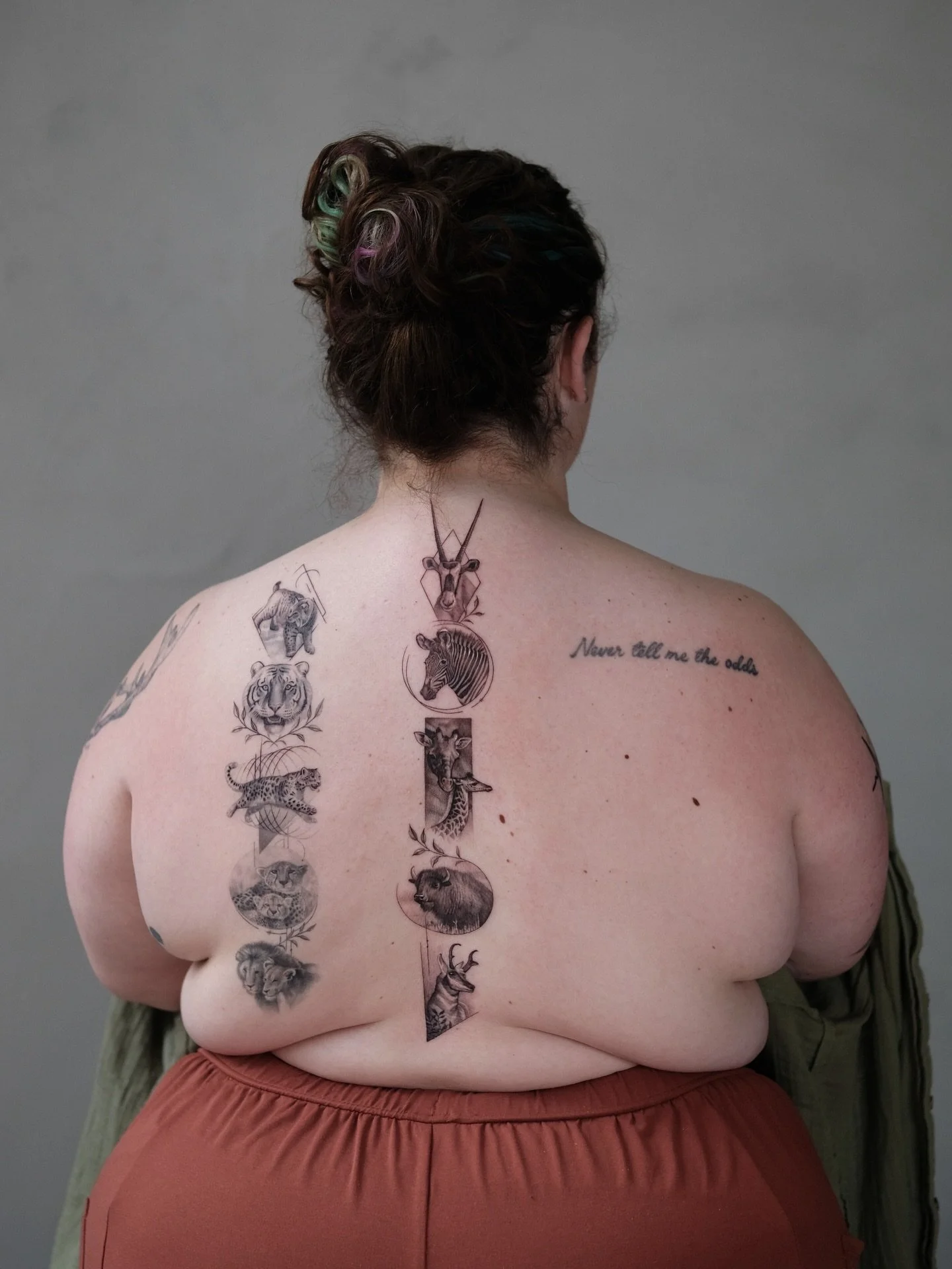 A back piece by Lauren (@law_ink) for her client, a zoo veterinarian, featuring the animals she works closely with every day.

Lauren specializes in black &amp; grey, micro-realism, and pet and wildlife portraits.

Explore more of her work at the lin