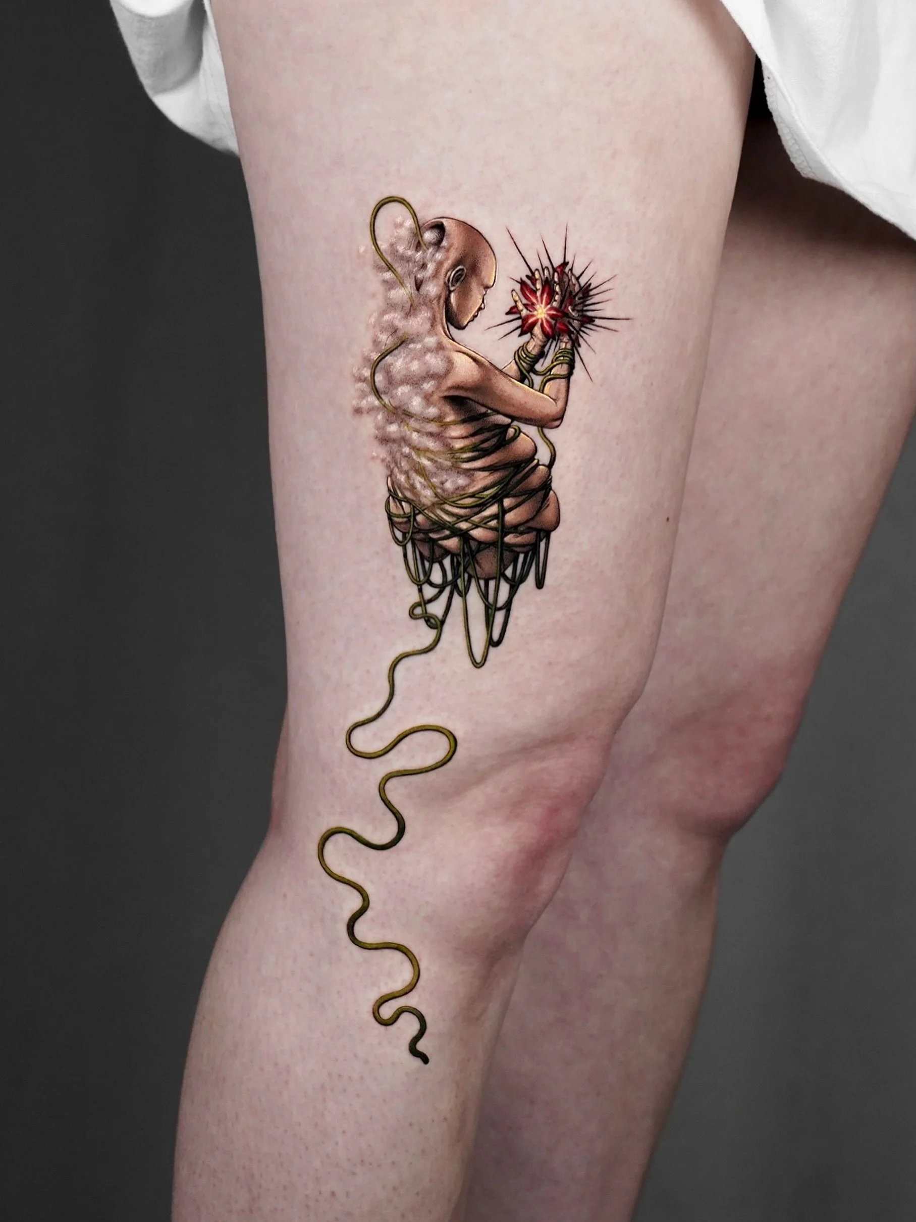 Done by @poesis_tattoo.

Drawing from her inner world and the complexities of human experience, Poesis creates surreal, dreamlike tattoos that blur the line between reality and imagination. Through a deeply collaborative process, she transforms each 