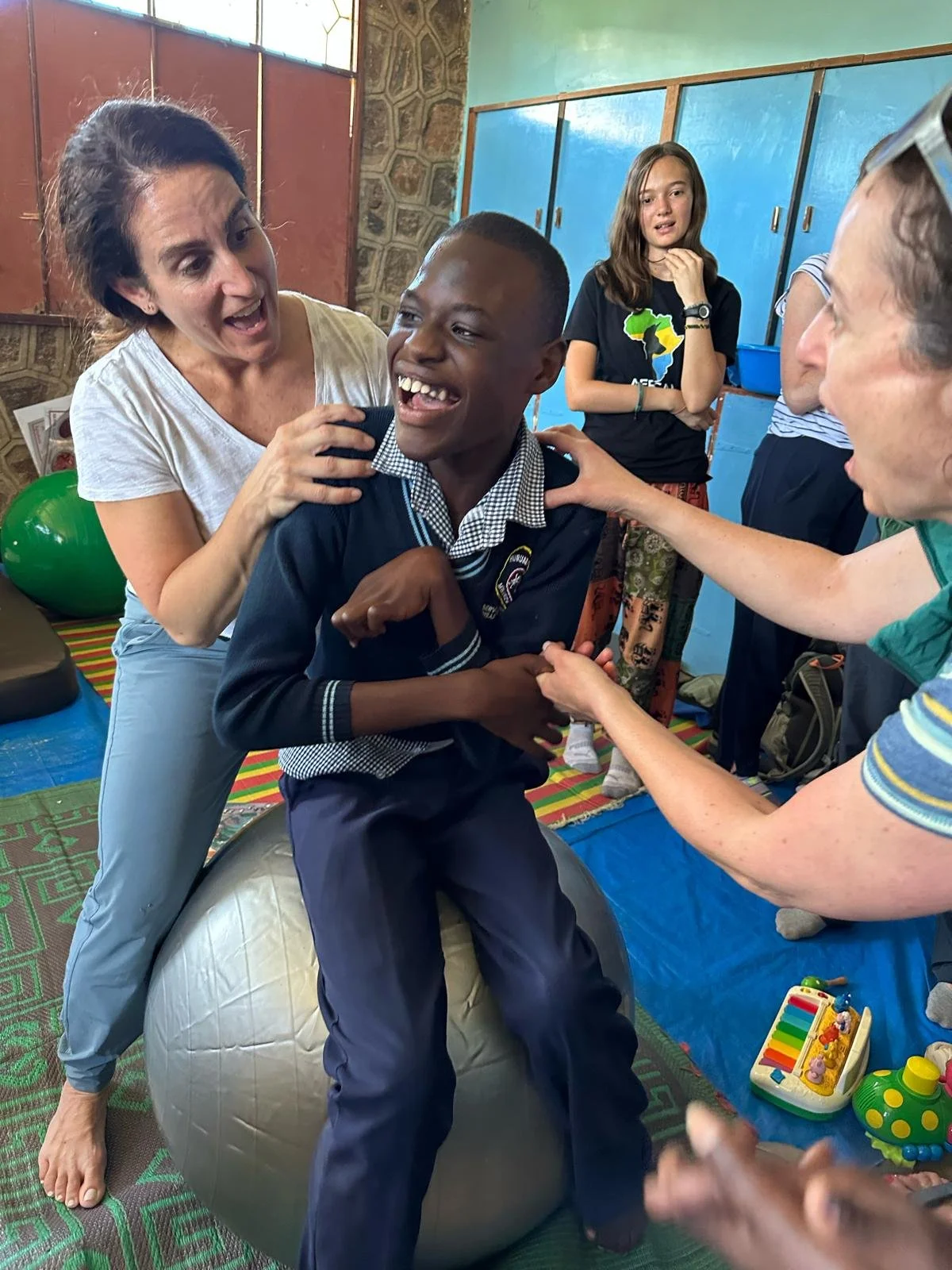 michelle with boy on ball.jpg