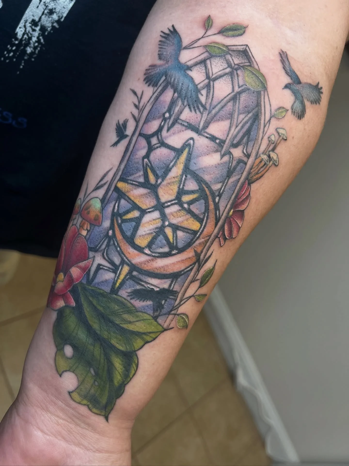 Gorgeous forearm piece done by Koryn! She loves color tattoos so fill out the form in our bio to book one with her!

#birdtattoo #stainedglasstattoo #colortattoo #flowertattoo #njtattooshop