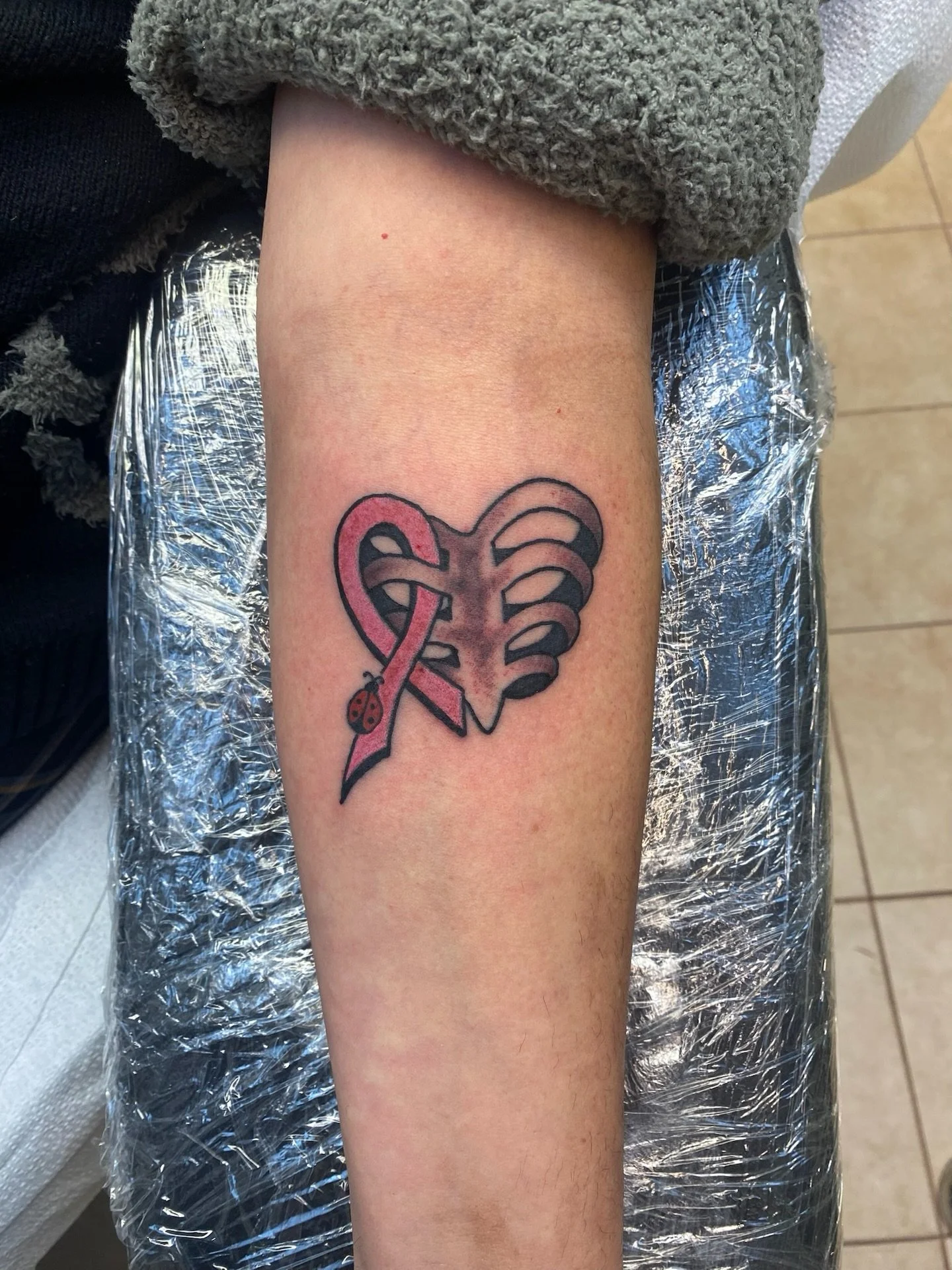 Such a meaningful piece done by Rich 🎗️ He has time to tattoo you this weekend so click the link in our bio or call/text 732-503-8469 to get in!

#cancertattoo #ribbontattoo #meaningfulltattoo #njtattooshop #colortattoo