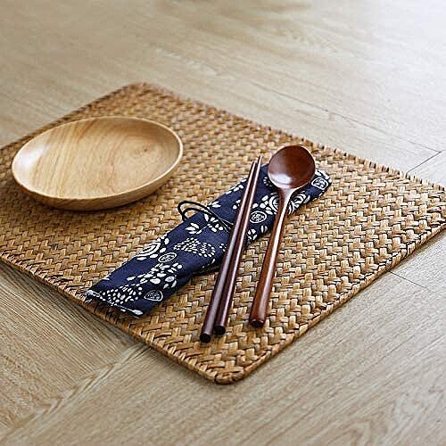 We love a rattan placemat! Plus, this one is large enough for everything you need.  