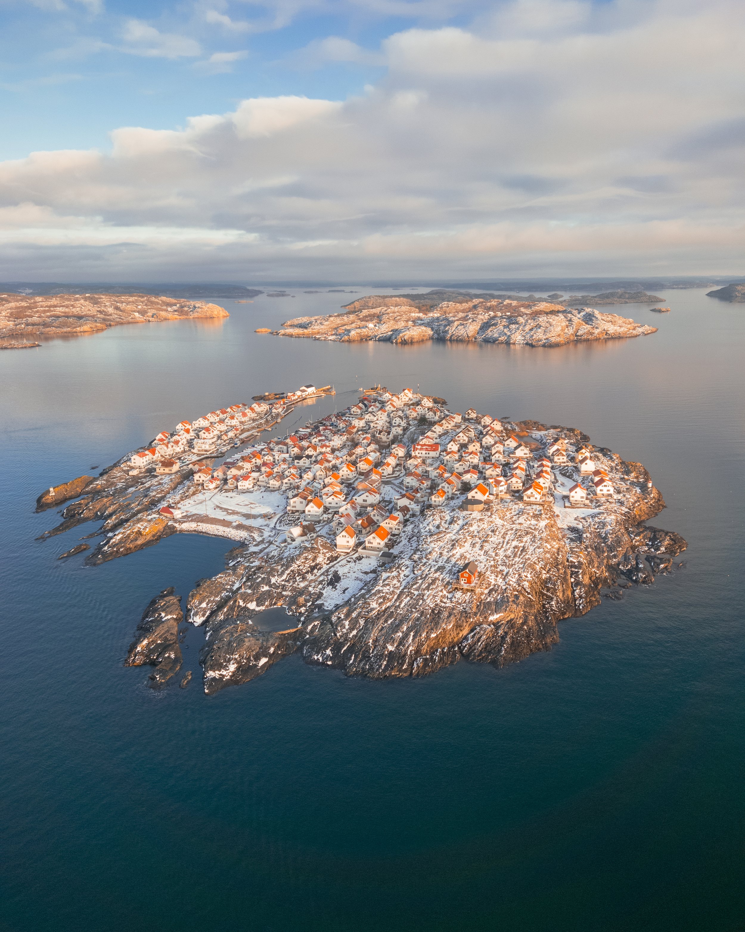 Airpixels' Tobias Hägg has captured the winter beauty of Åstol Island with this stunning aerial photograph. The image showcases the island in all its glory, with the surrounding icy waters and snow-covered landscape adding to the serene atmosphere. T