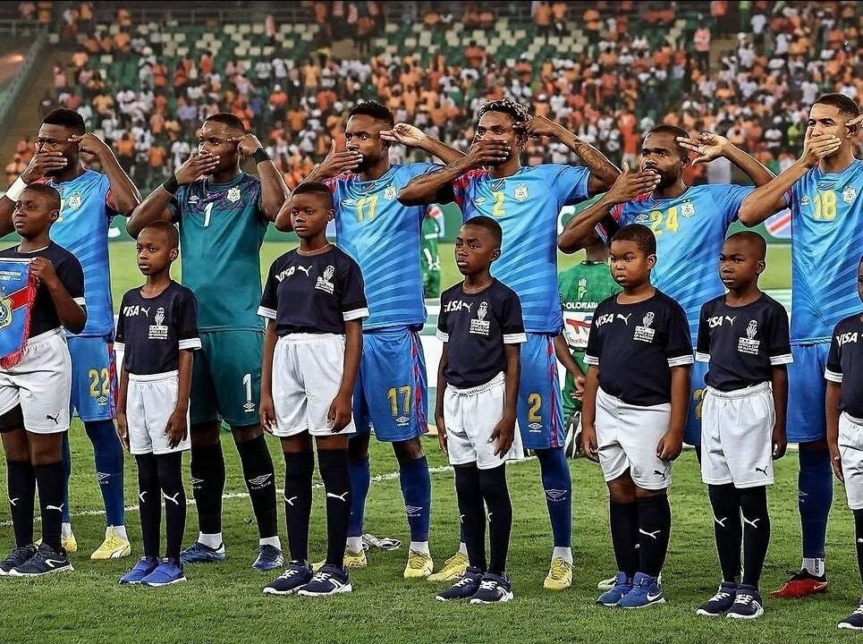 Players from @drccongo national made a gesture during their @caf_online semi-final match against Ivory Coast. The covering mouth and gun to the head gesture was made during the playing of the country's national anthem, to highlight the escalating vio