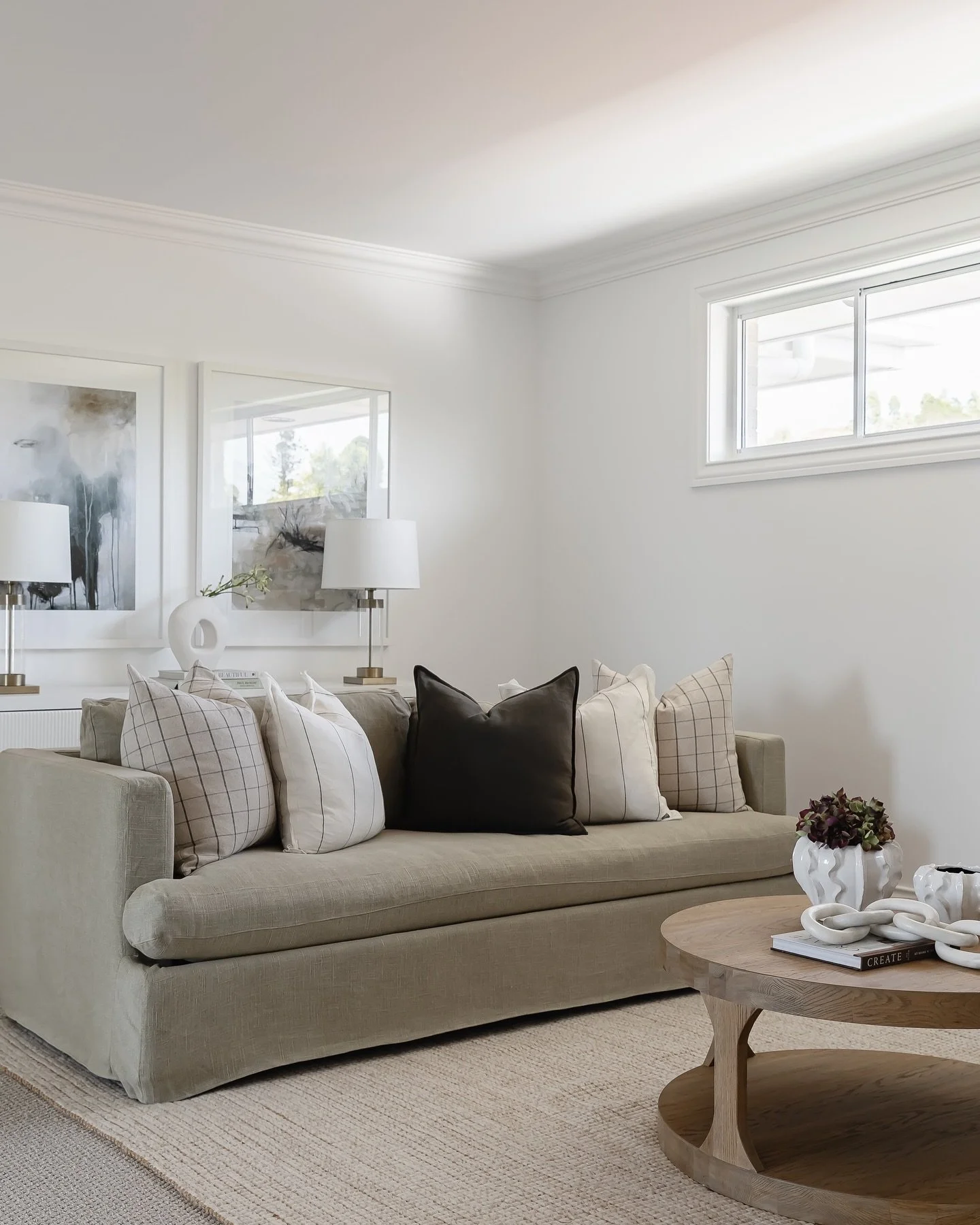 When a living room is longer than it is wide, we often choose to &lsquo;float&rsquo; the sofa off the wall and position a buffet or console table behind it.

This simple shift keeps the sofa perfectly proportioned to the TV, creates a natural walkway