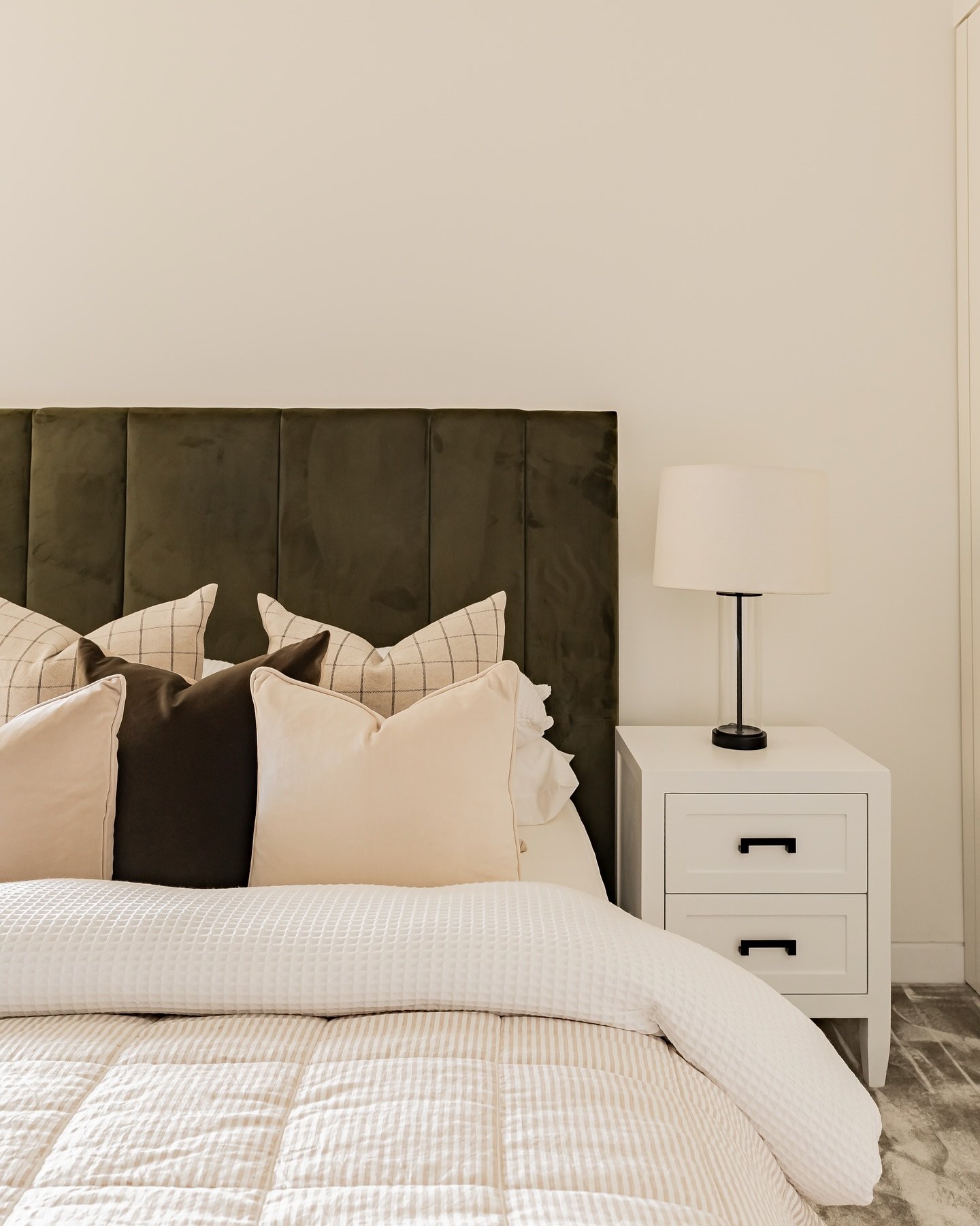 A bedroom that feels as good as it looks 🤍

Layered neutrals, soft textures and a touch of contrast in colour coming together to create a space that feels calm and inviting. From the crisp white linen to the warmth in the cushions, every detail has 