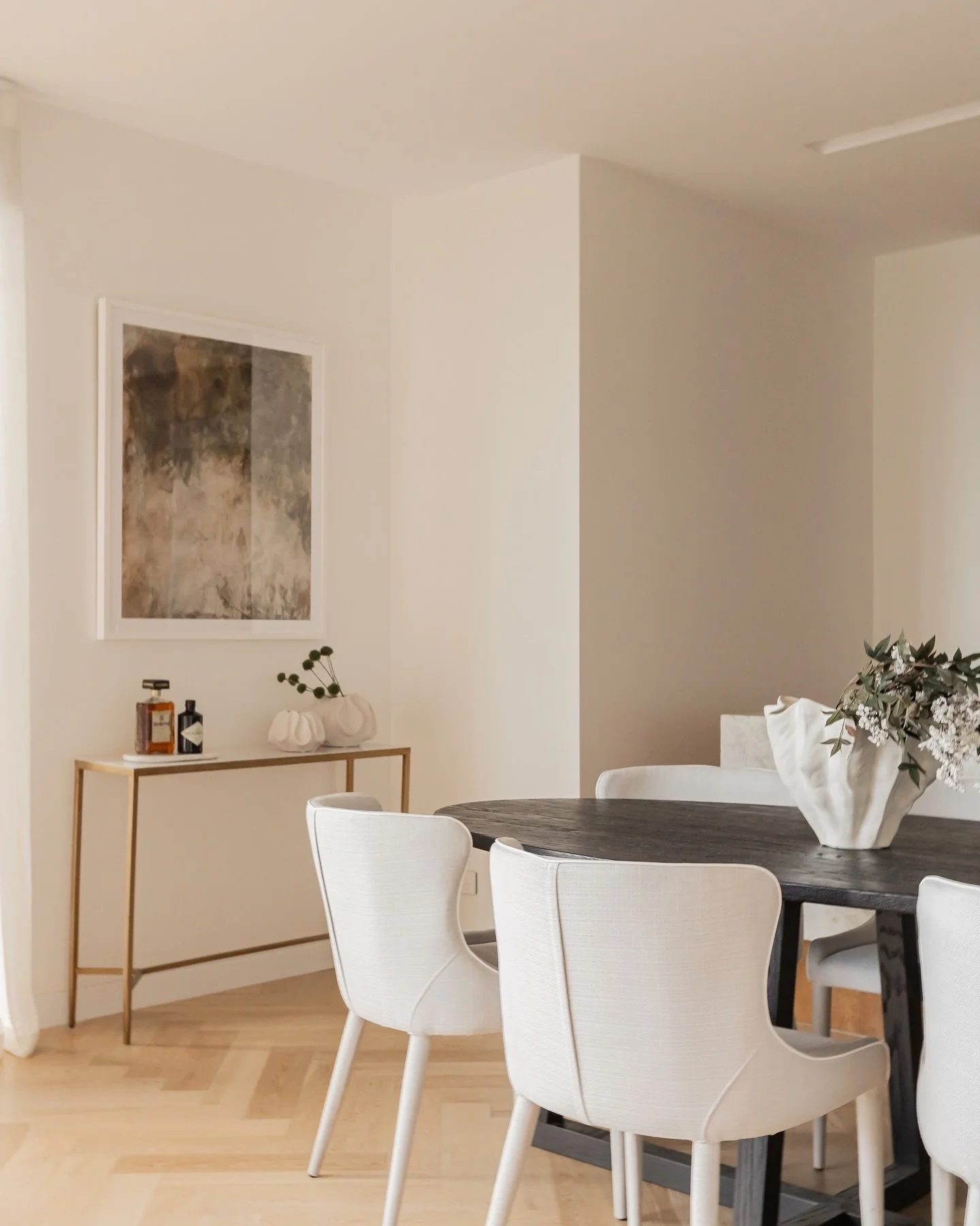 When styling a property, especially an apartment&mdash;it&rsquo;s essential to define how each space can be lived in. 

By introducing a console table to this dining area, we&rsquo;ve created a subtle yet purposeful space. It becomes the perfect drop