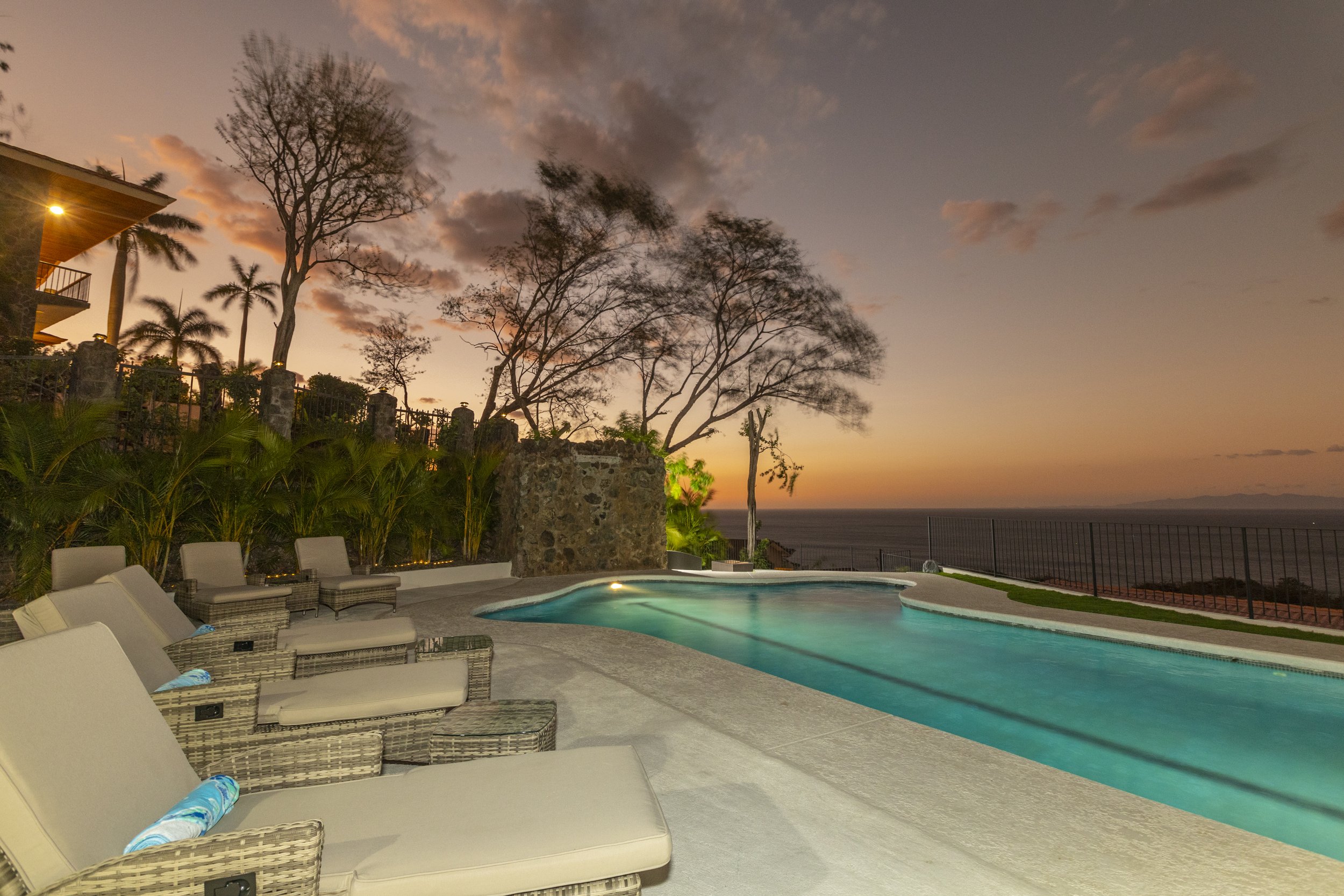 PE Exterior Pool Sunset with Lounge Chairs.jpg