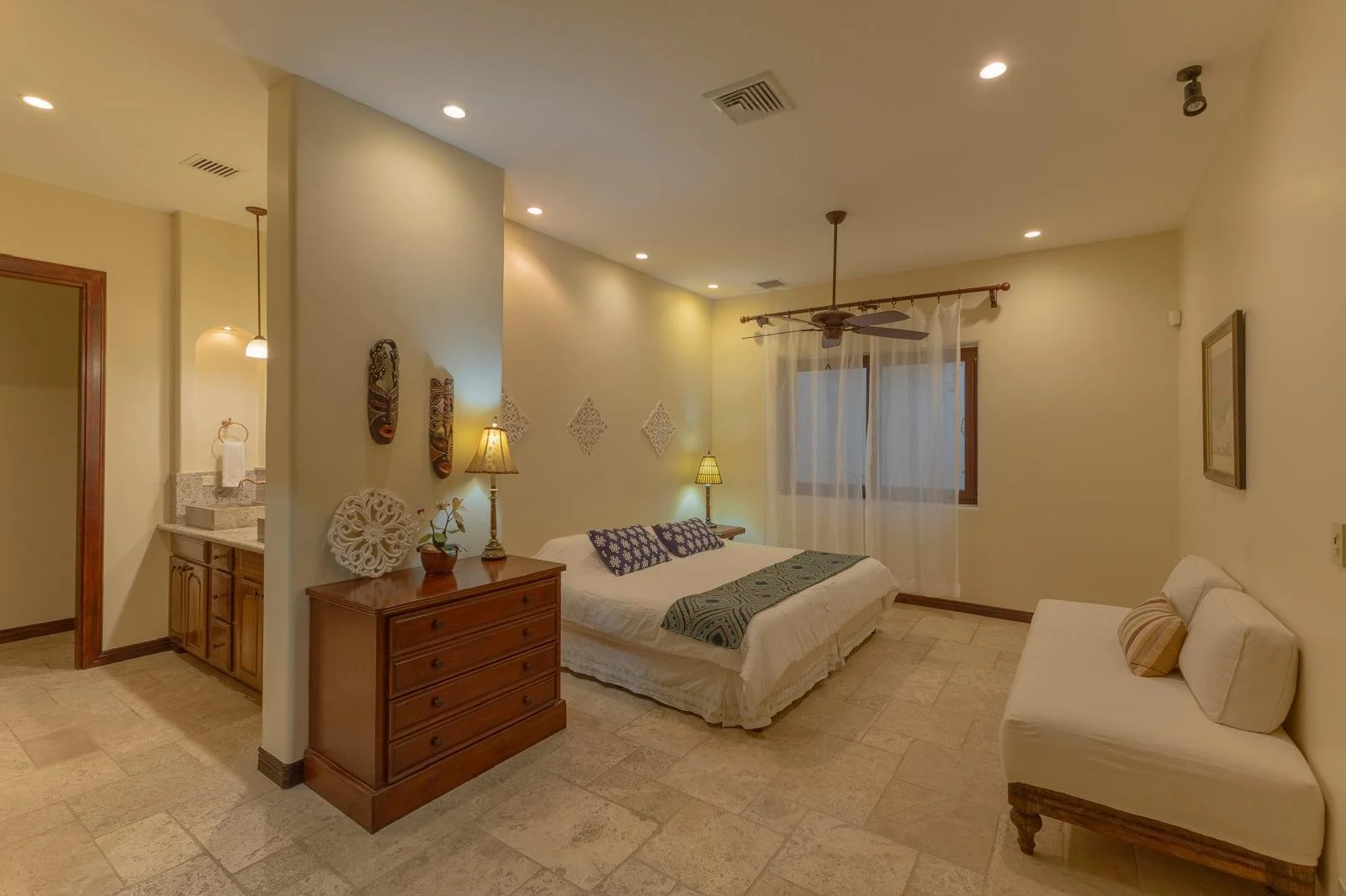Durazno Bedroom with bathroom masks on wall.jpeg