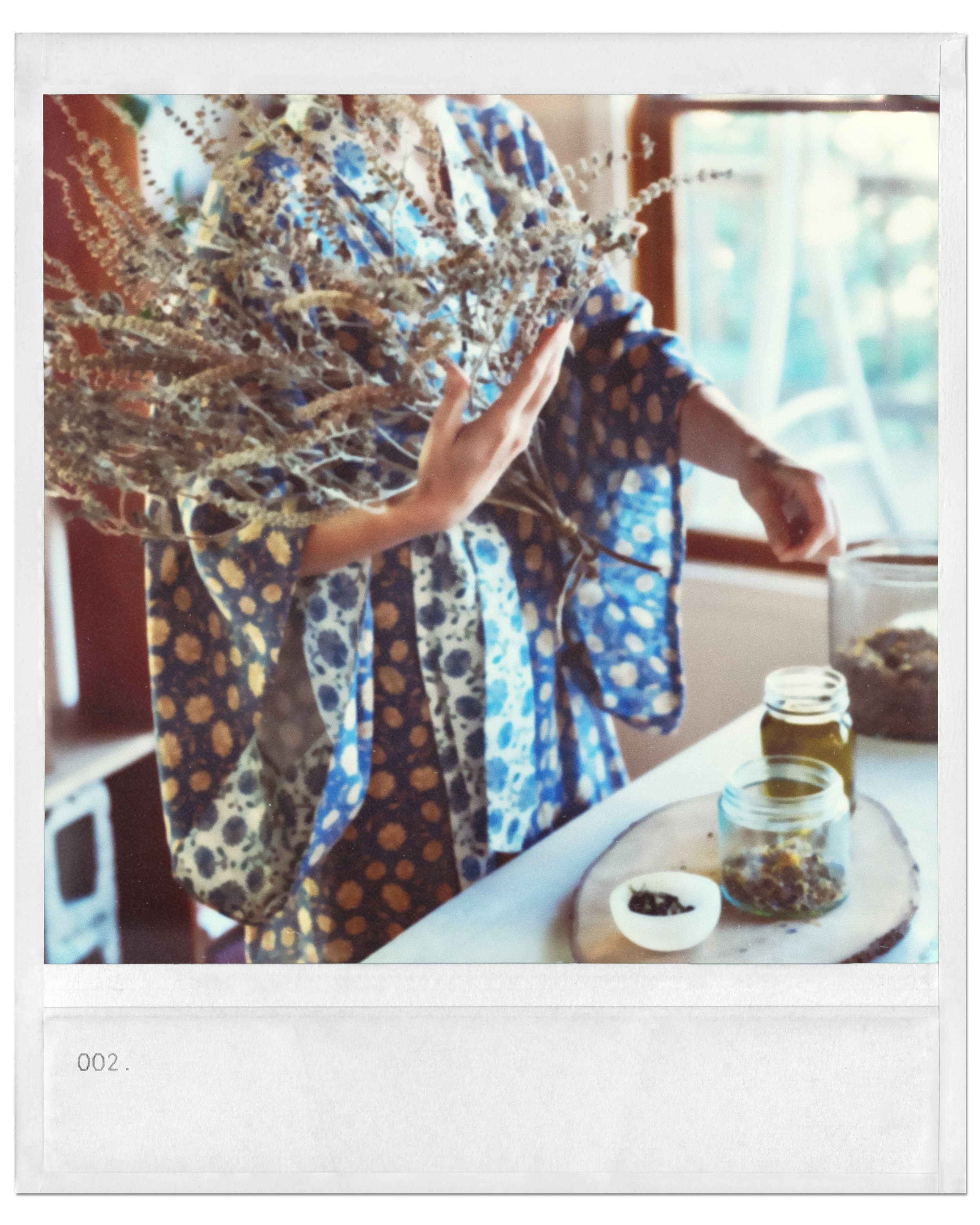 a woman preparing herb in a kitchen