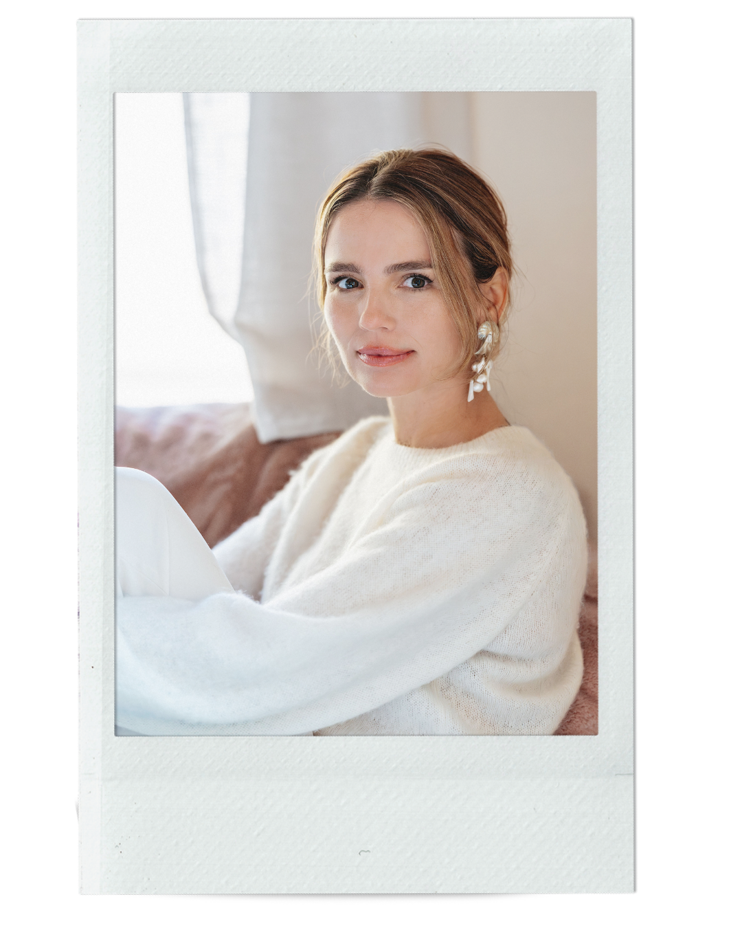 portrait headshot of a woman sitting on a couch