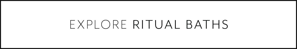 Text that says 'Explore Ritual Baths' in a minimalistic font.