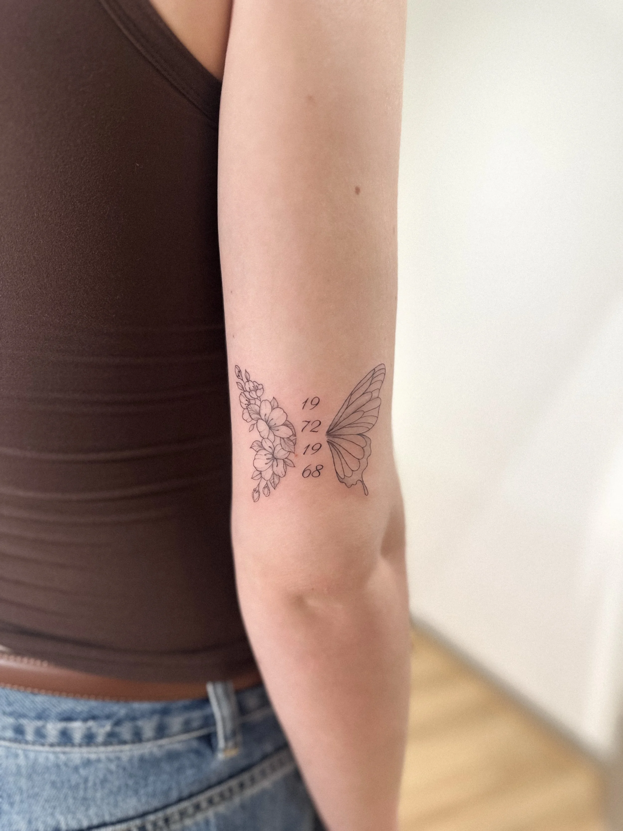 A meaningful fine line piece combining florals, butterfly wings and significant dates.

Simple, personal and designed to hold a story.

Booking inquiries via the website &mdash; dayoneatelier.com.au
Link in bio.

#finelinetattoo #memorialtattoo #butt
