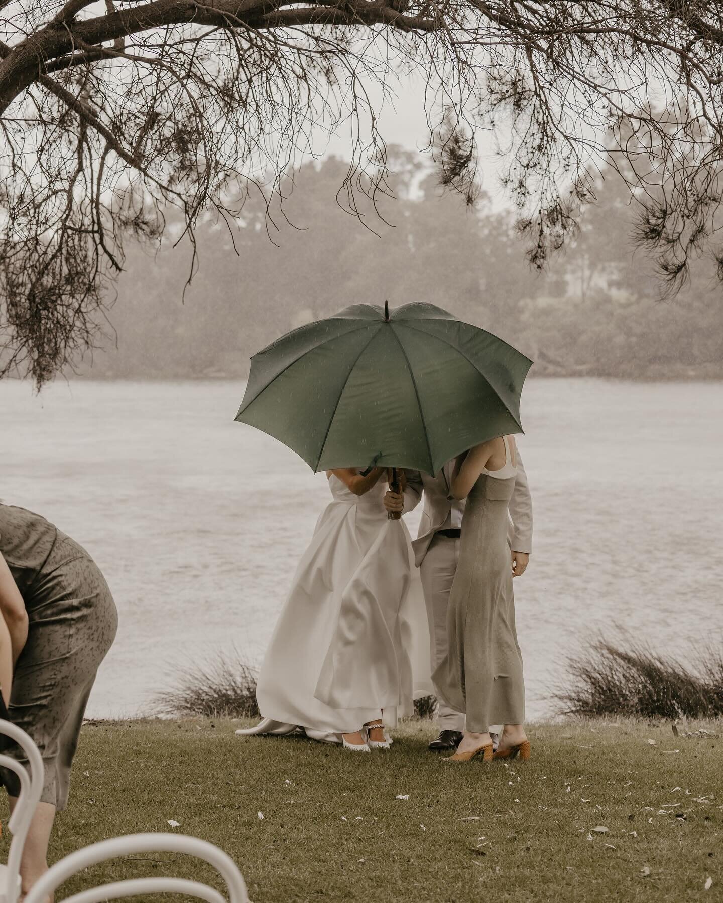 Majority fear rain on their wedding day depending on the time of year, some have a plan B (highly recommend) and others take it in their stride just as Jasmine and Johnathon did. 

They managed to stay dry and for the few short minutes of a downpour 