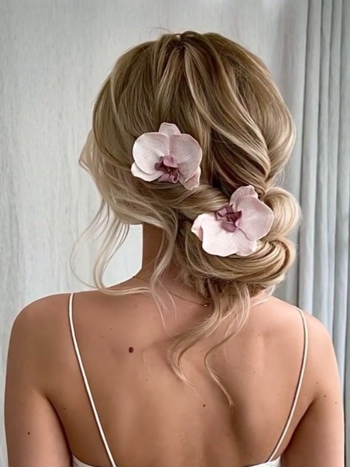 handmade polymer clay orchid hairpin set in dusty pink worn in bridal hairstyle