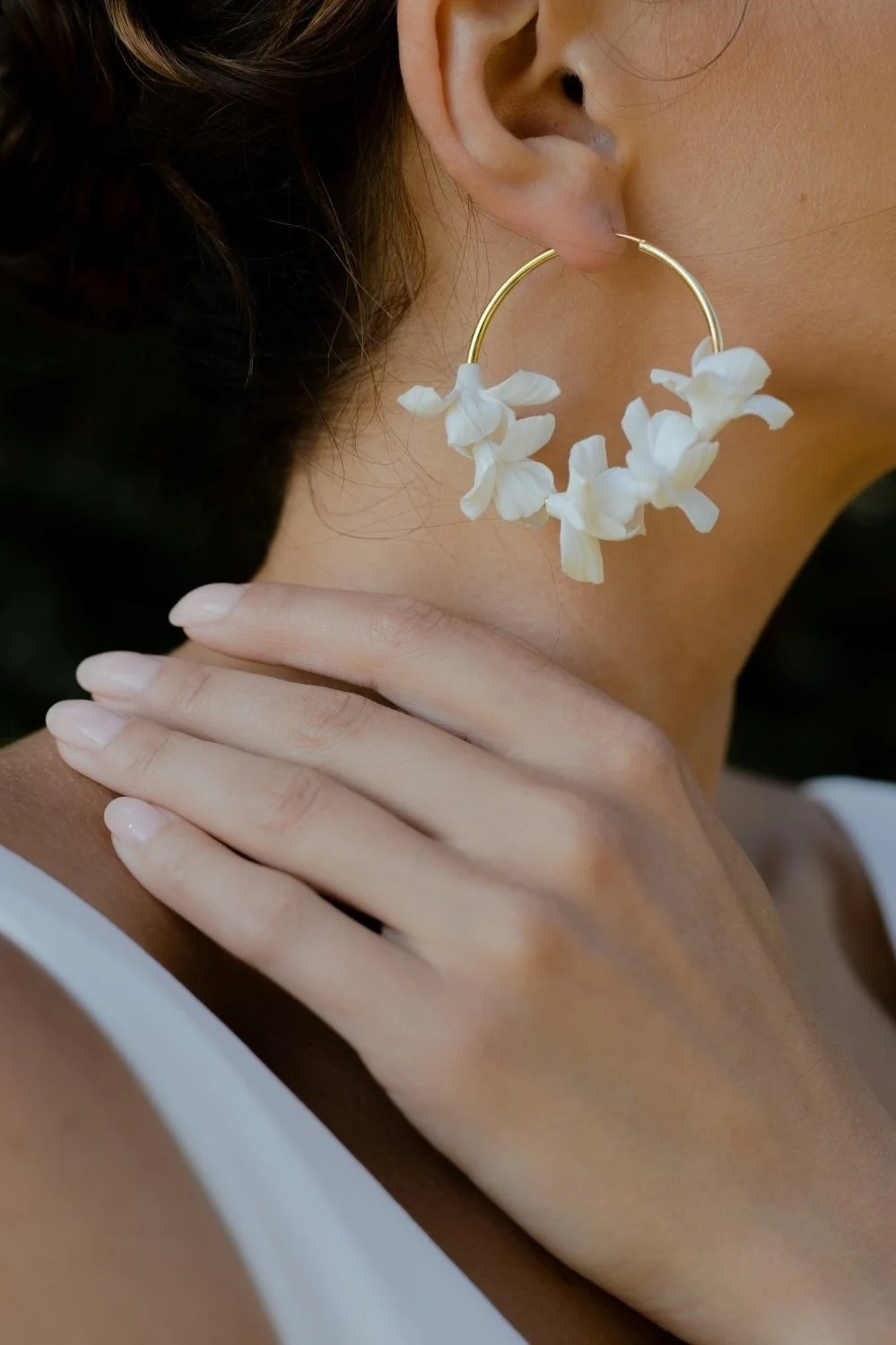 bride wearing floral hoop earrings lightweight bridal jewellery wedding day earrings