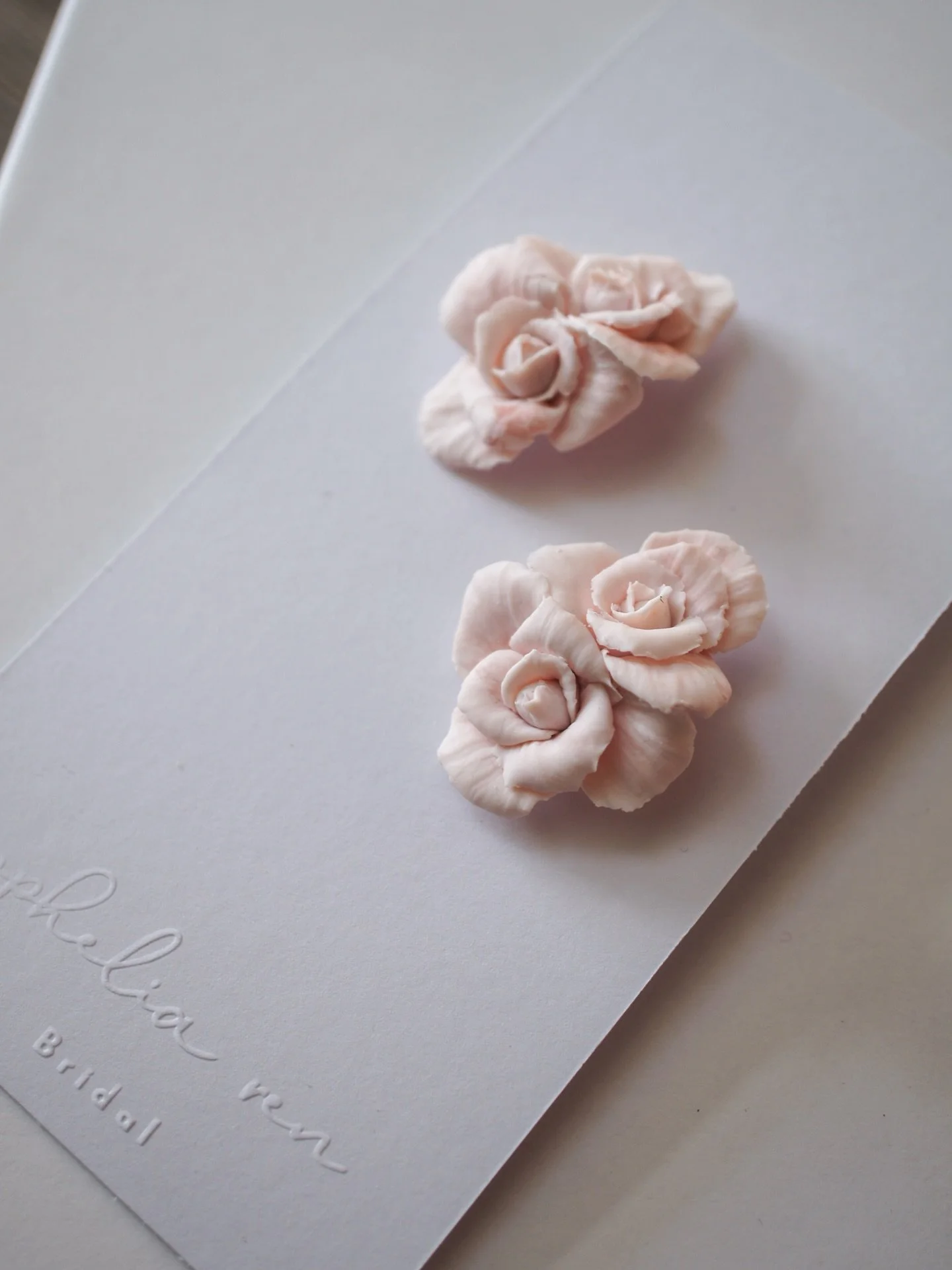 I love working on the little details that make each piece feel alive&mdash;the curve of a petal, the subtle shift in colour.

These wedding day earrings are a simple pairing of roses, lightweight and delicate in soft pink&mdash;but I can create them 