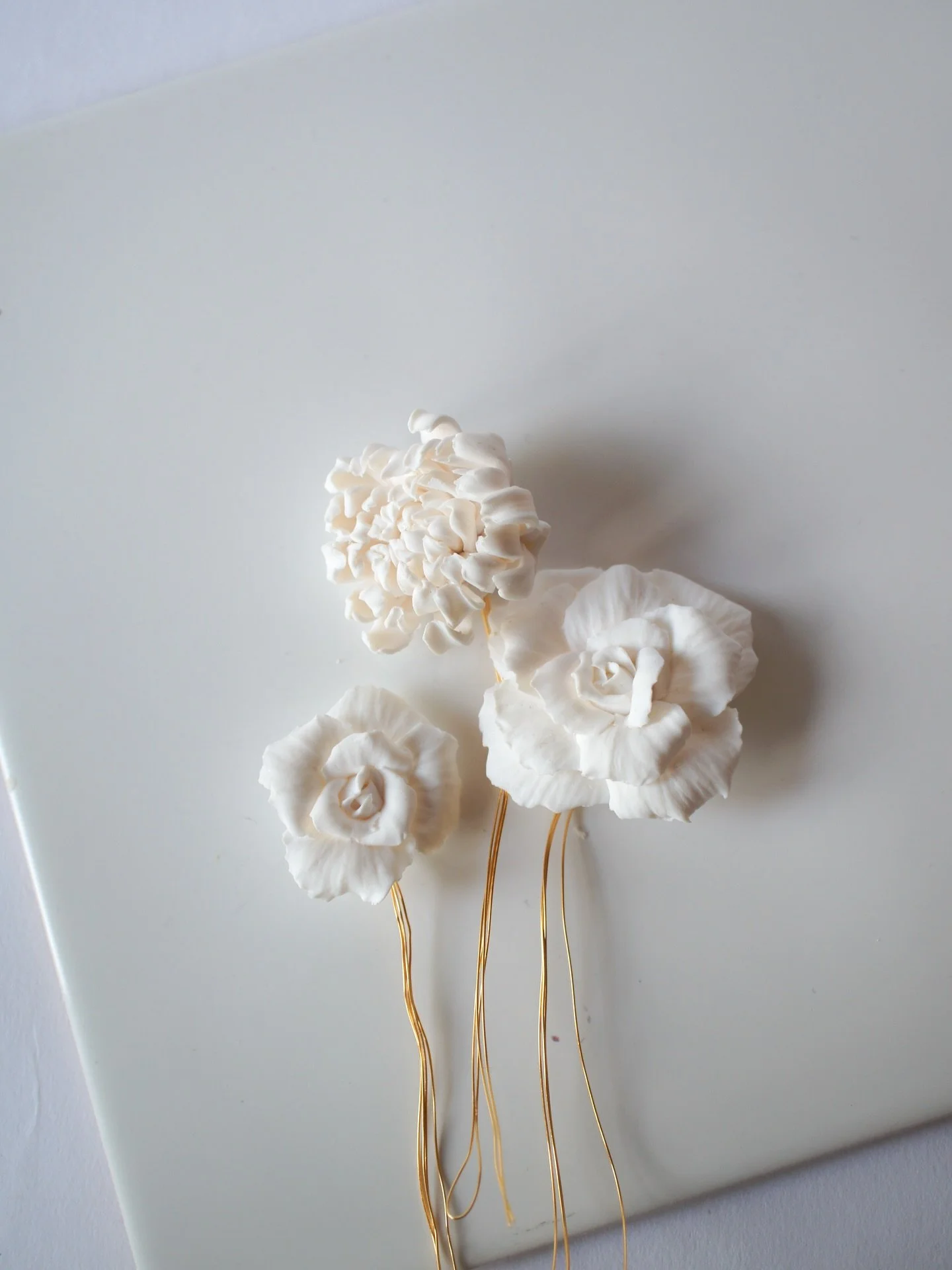 A little bridal hair inspiration showing various looks with floral pins 

I thought I&rsquo;d spotlight the rose hair pin because I love its classic simplicity &mdash; it creates sophisticated looks for a range of wedding hairstyles.

Whether paired 