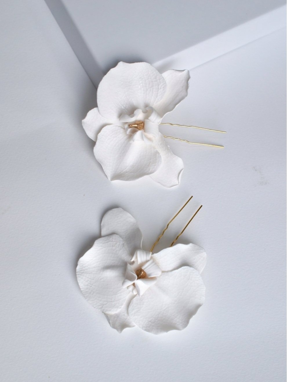 handmade polymer clay orchid hairpin set in white with gold detail