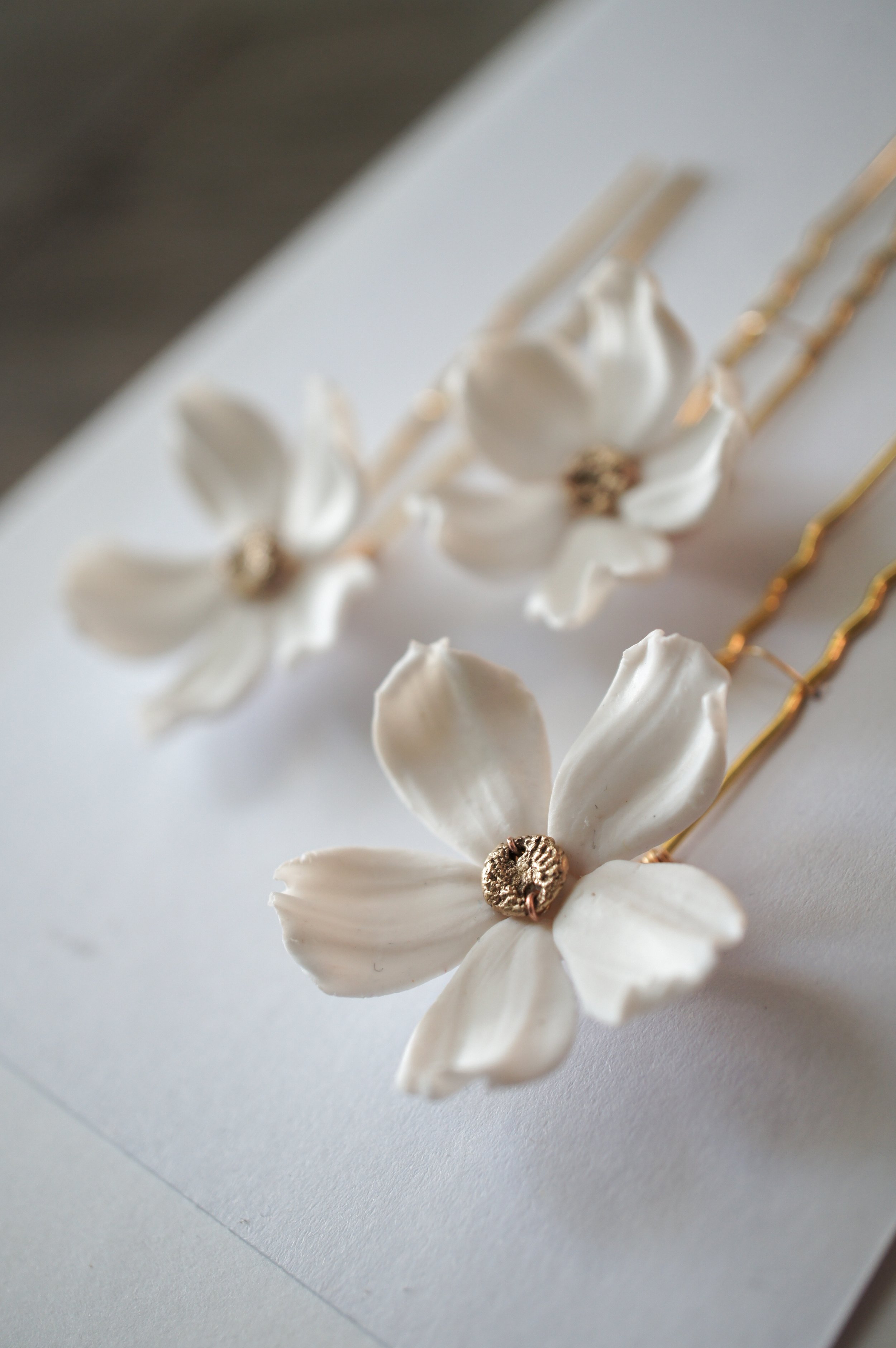 Cosmos Purity hairpins in white and bronze