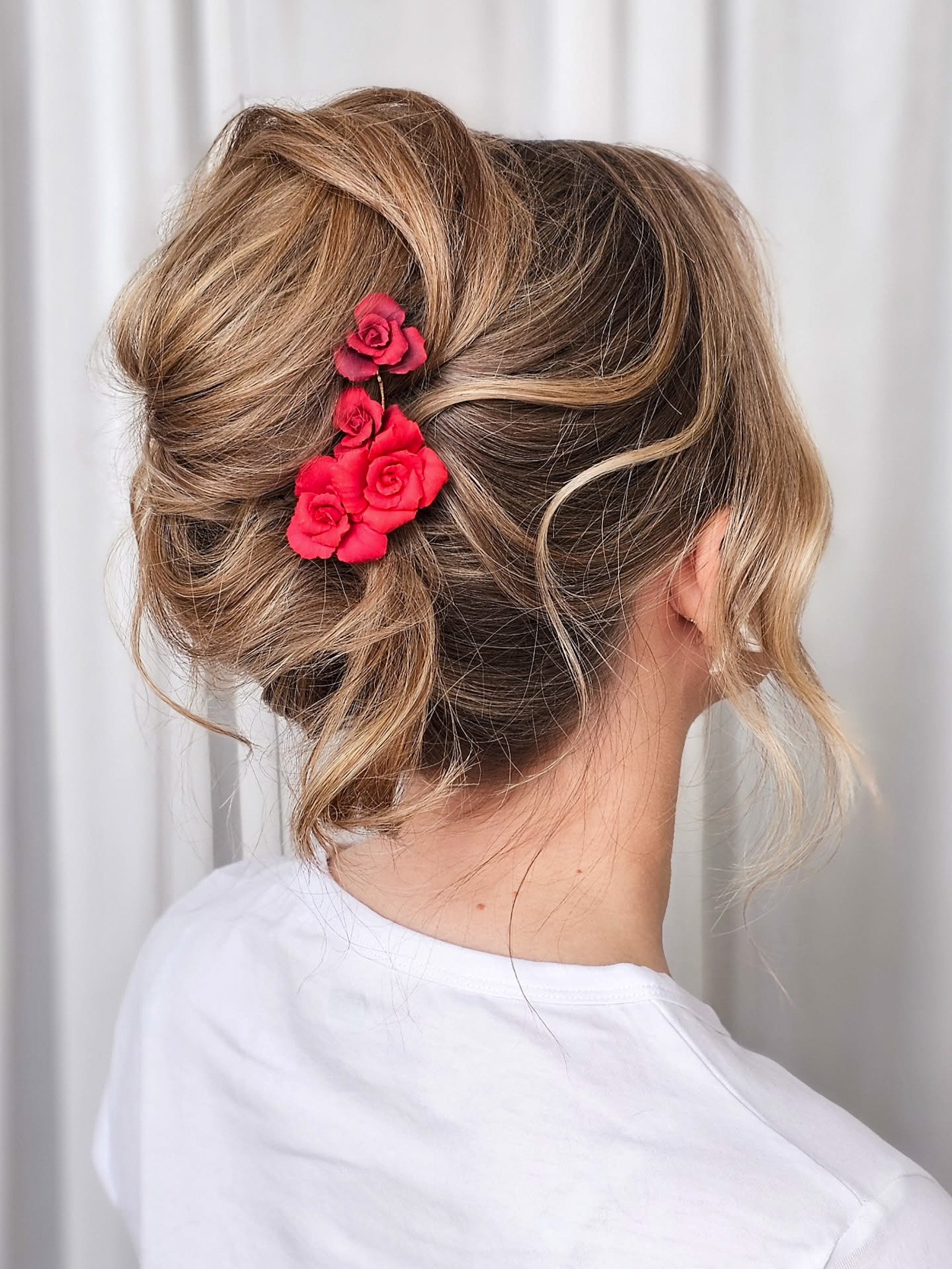 Two red rose bridal hairpieces, versatile styling for updos, side placement, or together for romantic wedding hairstyles.